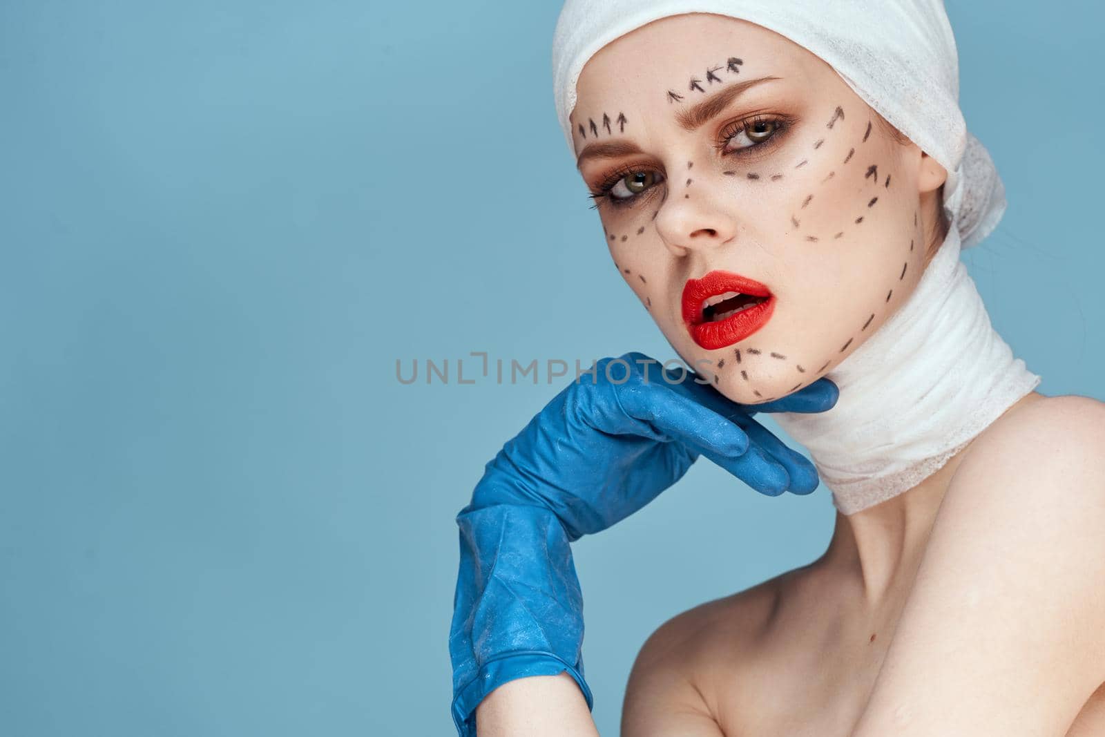 woman in blue gloves syringe in hands contour on the face lifting studio lifestyle by Vichizh