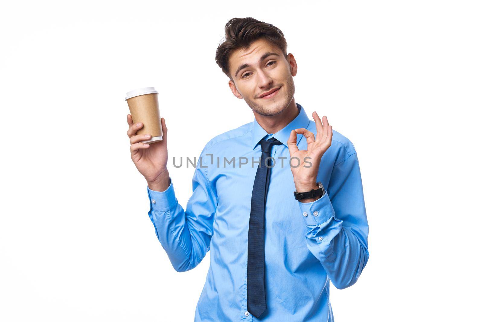 businessmen communication on the phone a cup of coffee light background by Vichizh