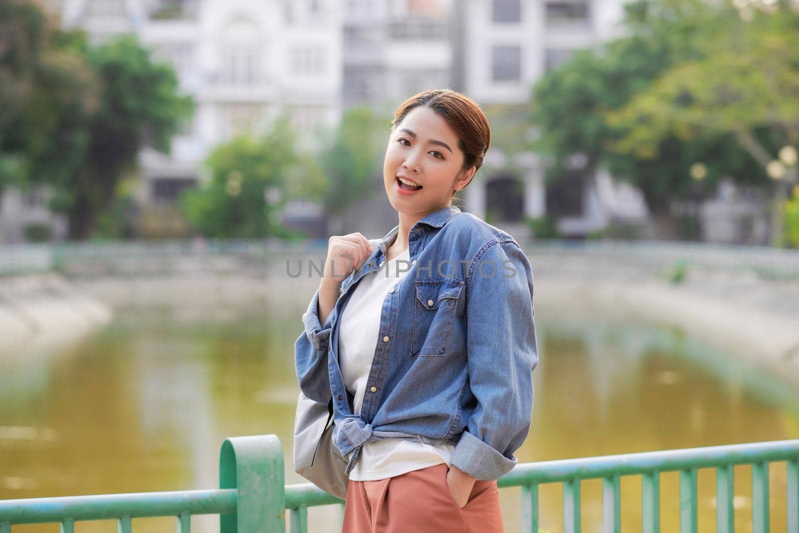  Female college student relax and enjoy outdoor lifestyle activity in summer day