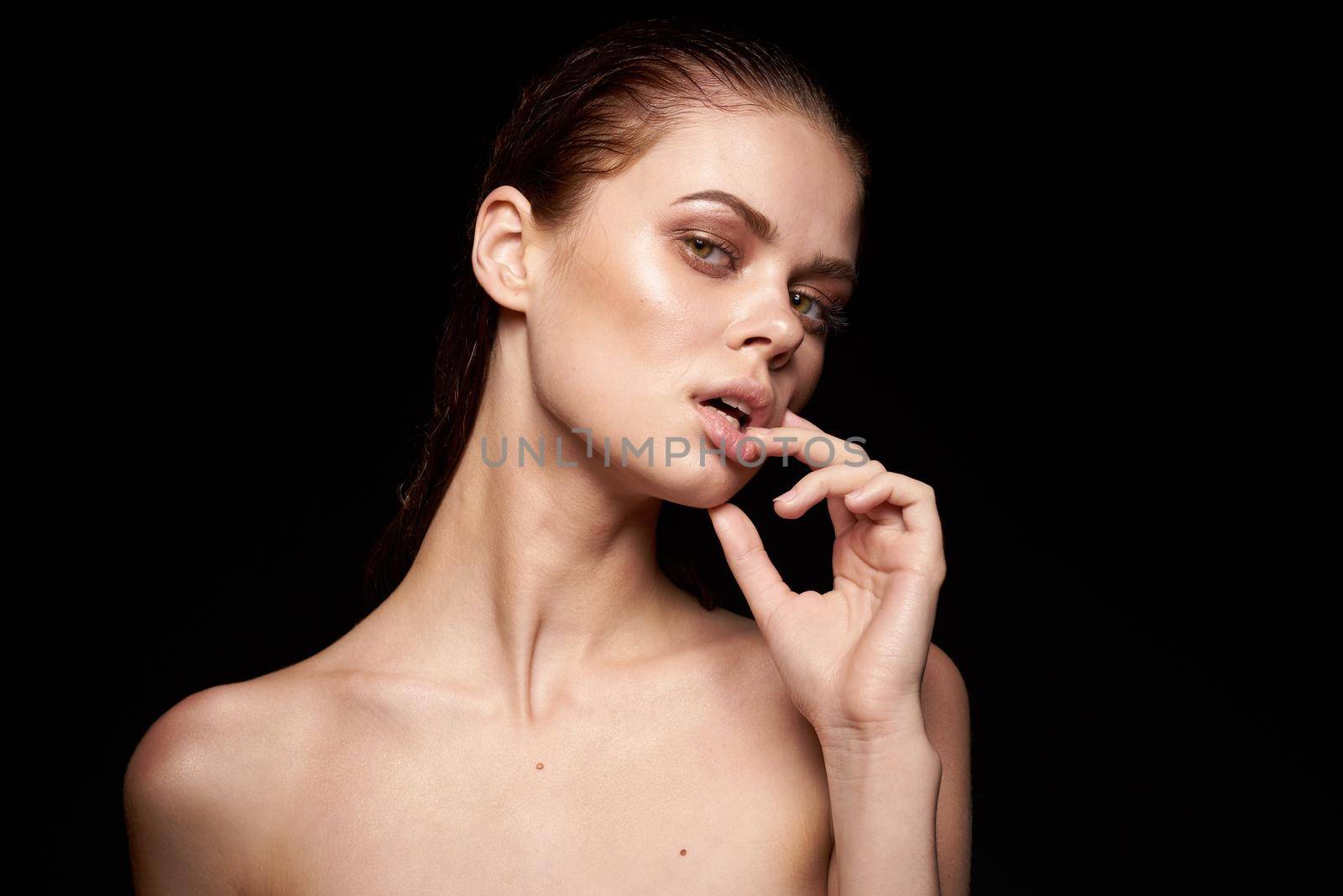 beautiful woman emotions gesture hands bare shoulders close-up. High quality photo