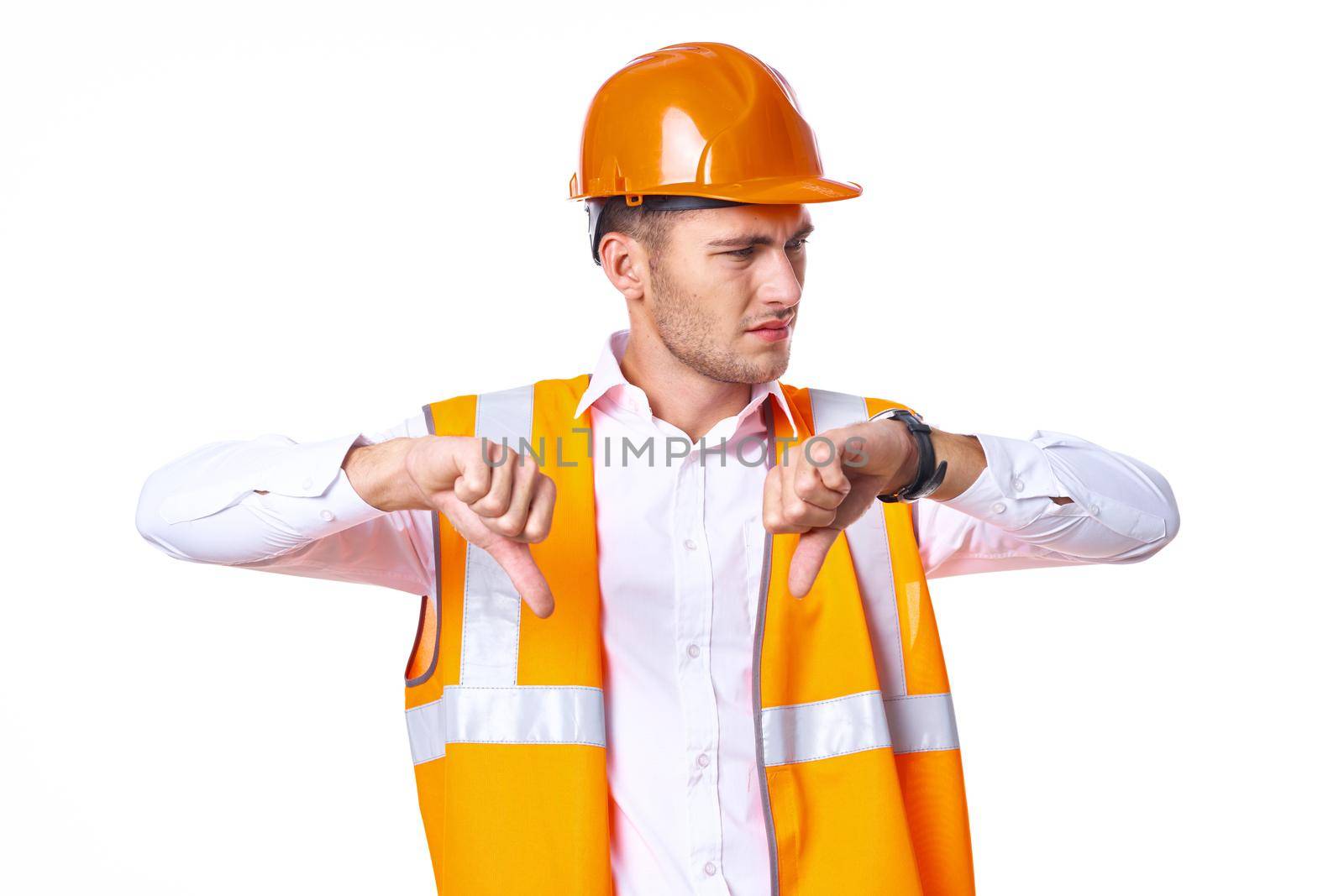 working man in orange uniform posing construction. High quality photo