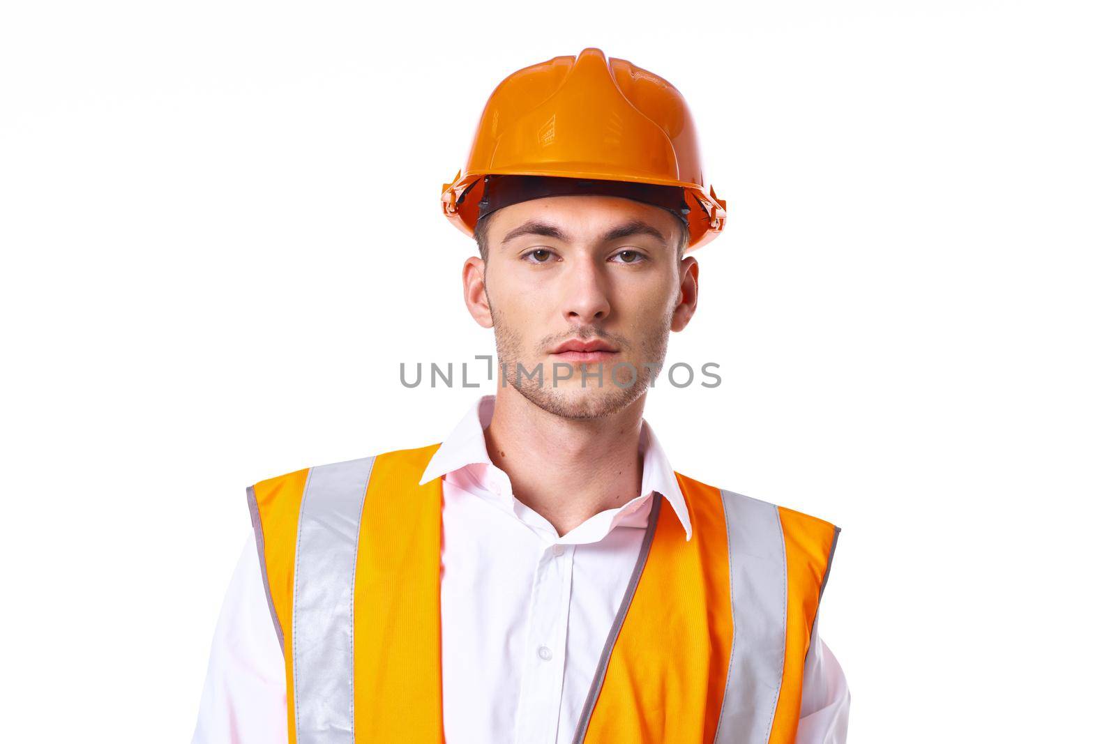 engineer in orange vest posing job professional. High quality photo