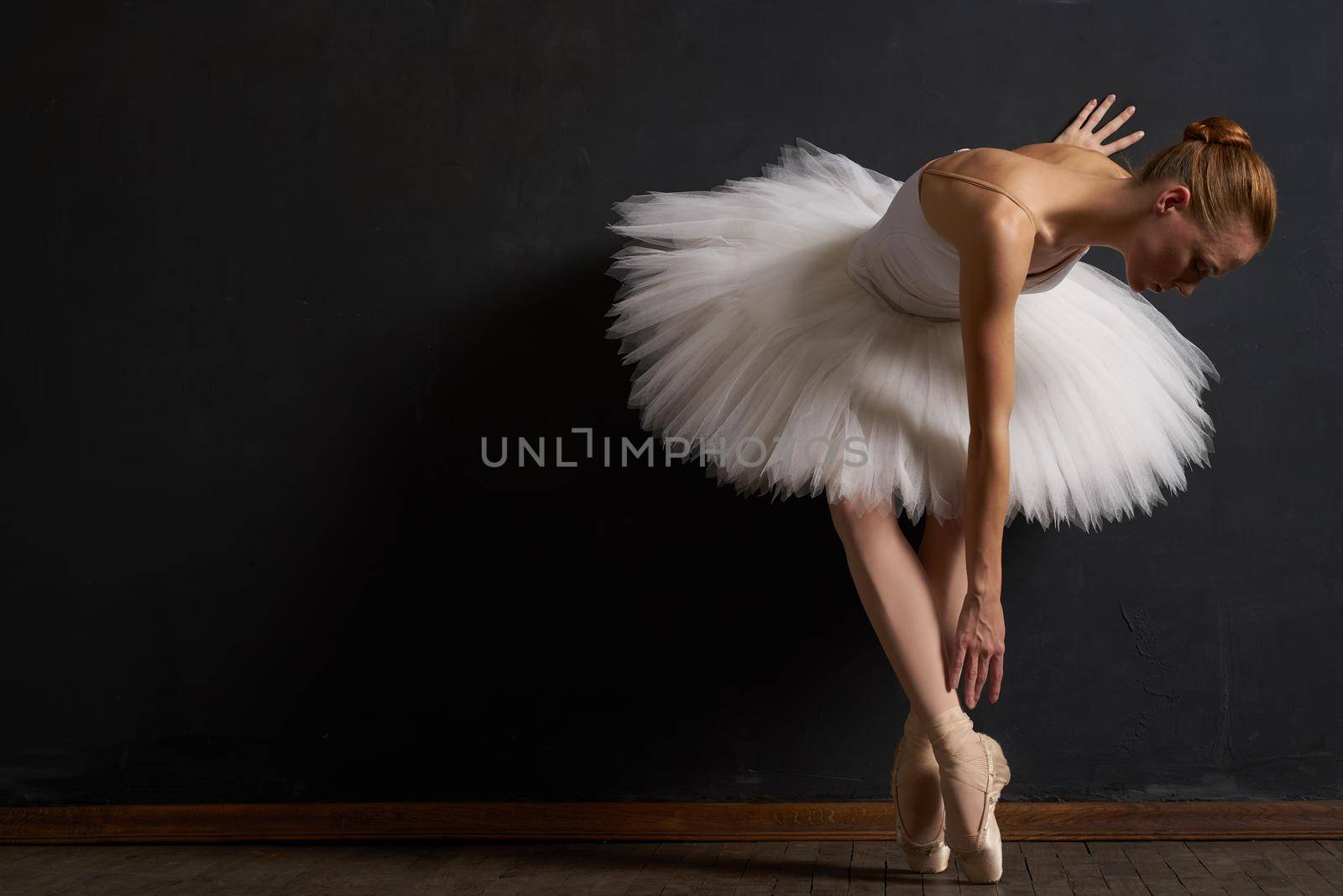 ballerina dance performance classic dark background tradition. High quality photo