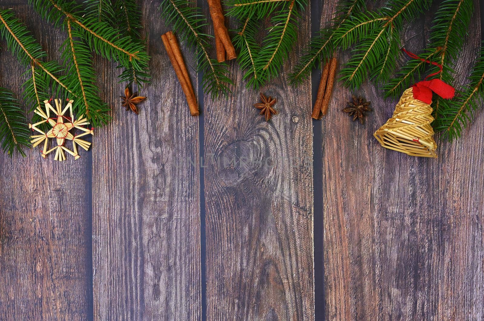 Christmas background with decorations on a brown wooden background. Flat lay, top view with copy space.