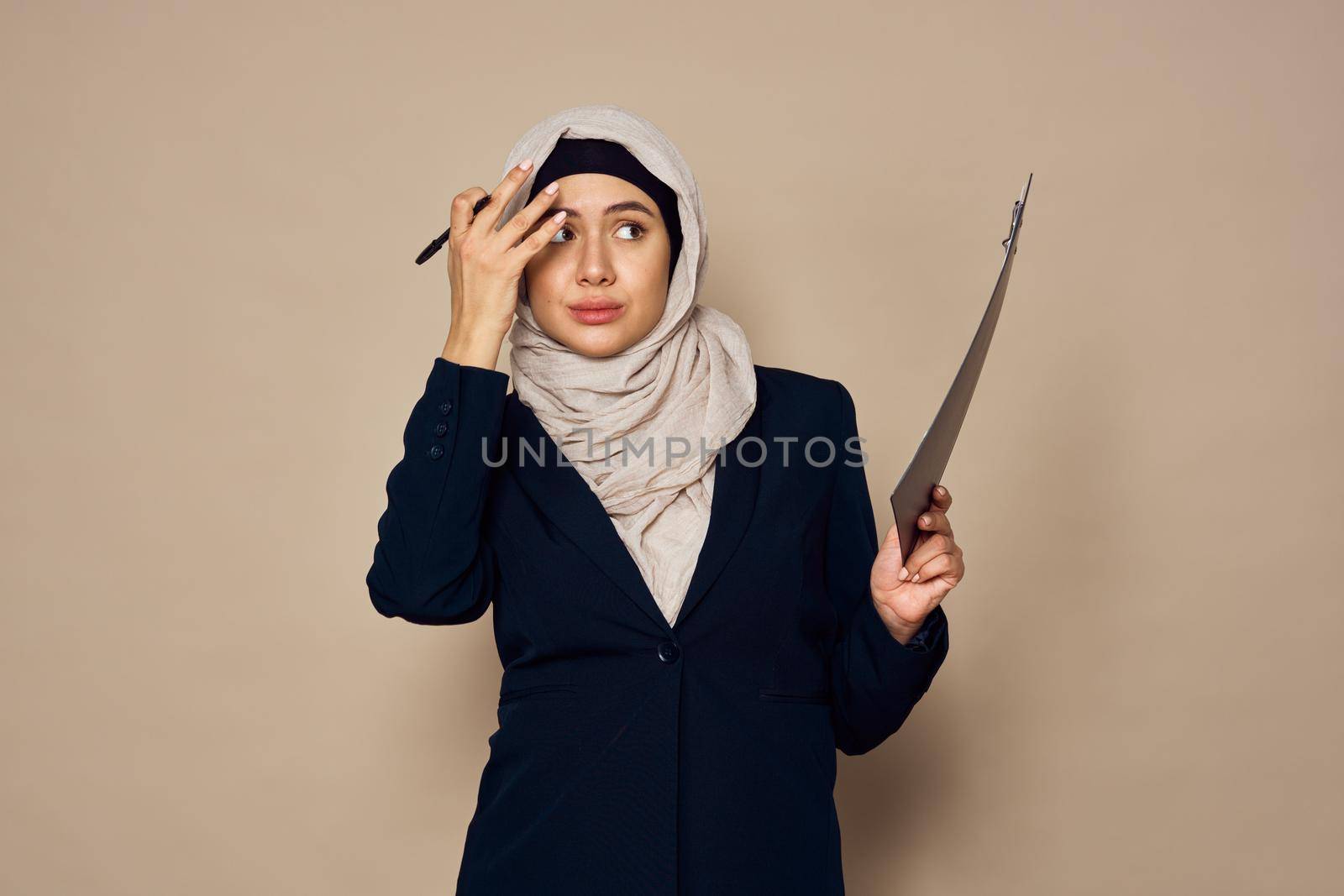 muslim woman with documents in hands office work business. High quality photo
