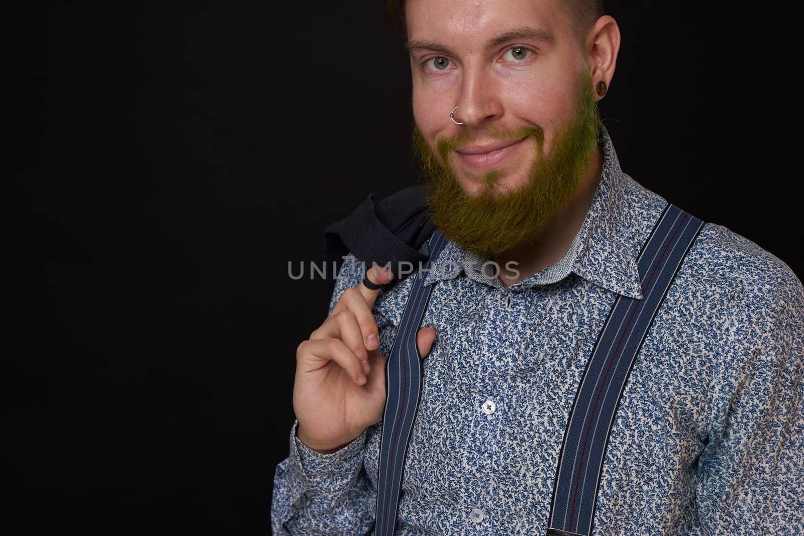 business man in shirt with jacket over his shoulders posing self confidence. High quality photo