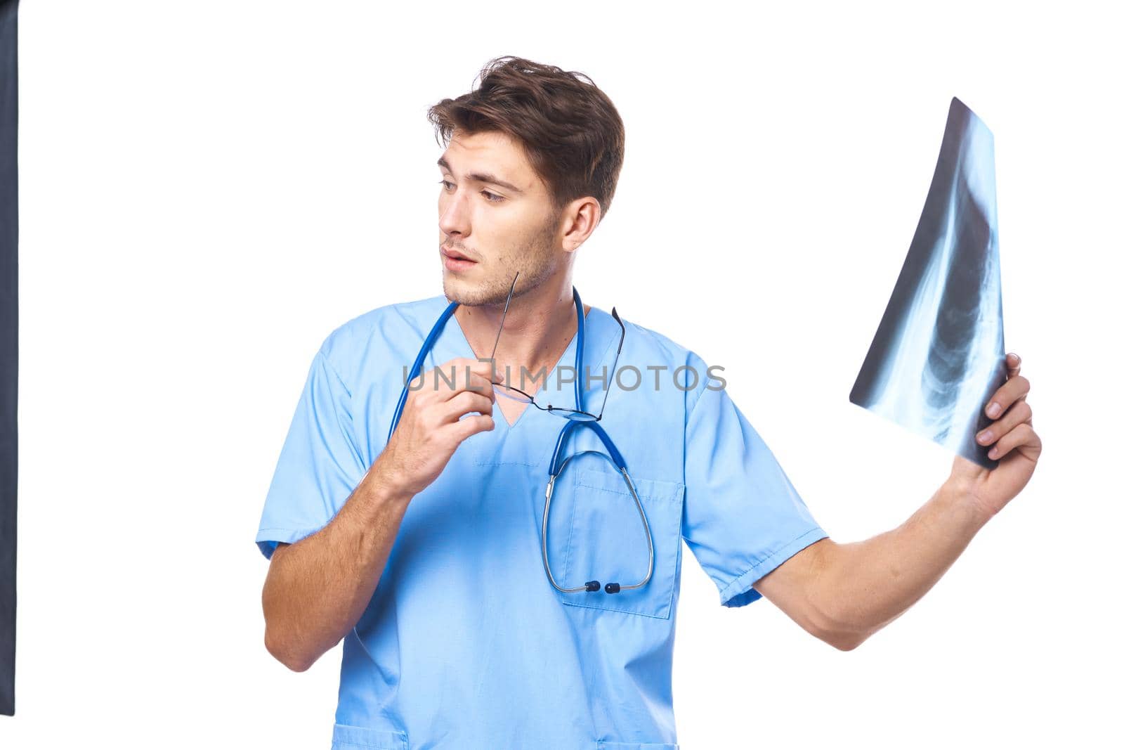 radiologist x-ray diagnostics stethoscope examination work light background. High quality photo