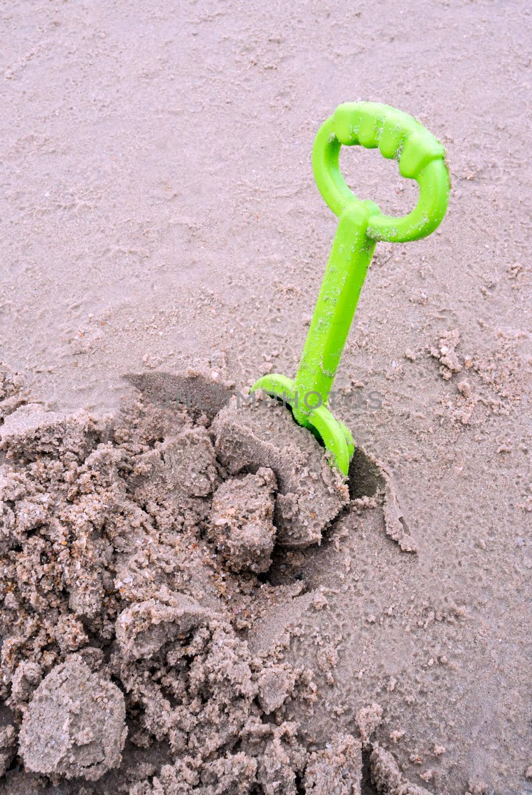 Plastic toy for play with sand at the beach by Satakorn