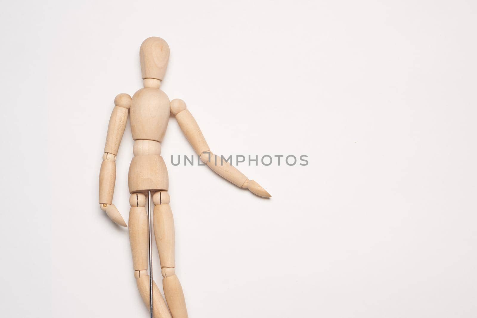 wooden mannequin object close up light background. High quality photo