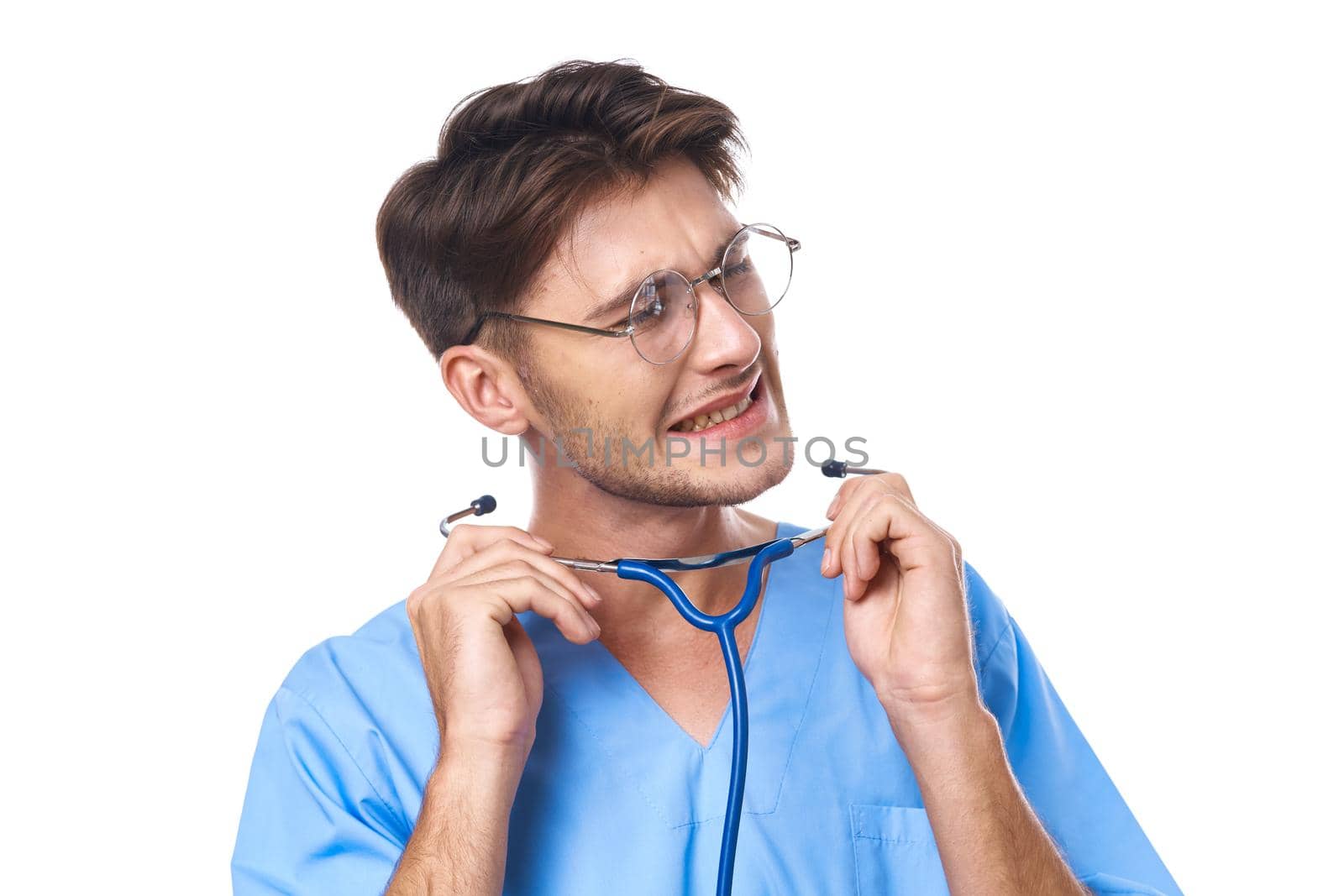 man in medical uniform health care treatment stethoscope examination studio lifestyle. High quality photo