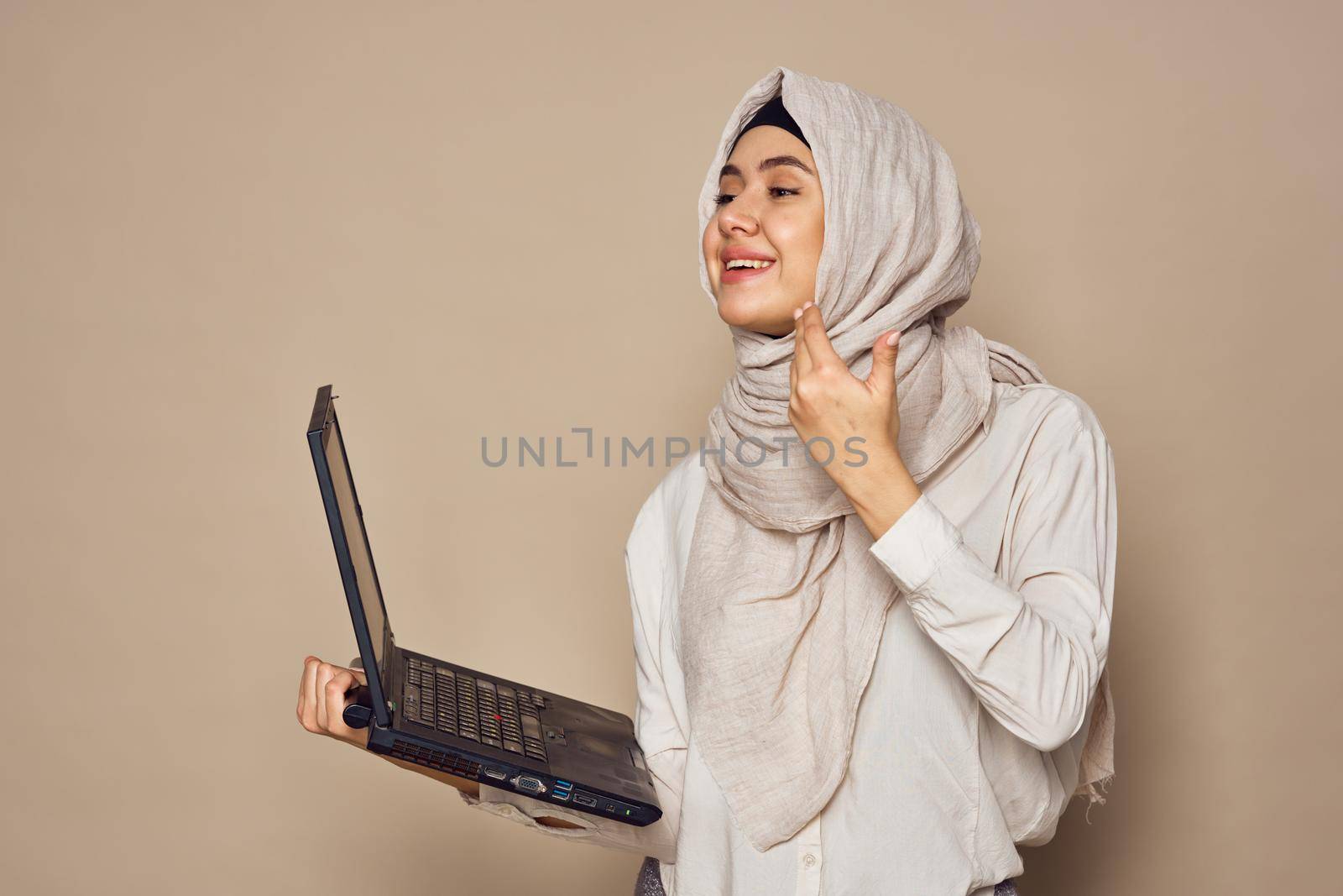 muslim woman with laptop work learning technology. High quality photo