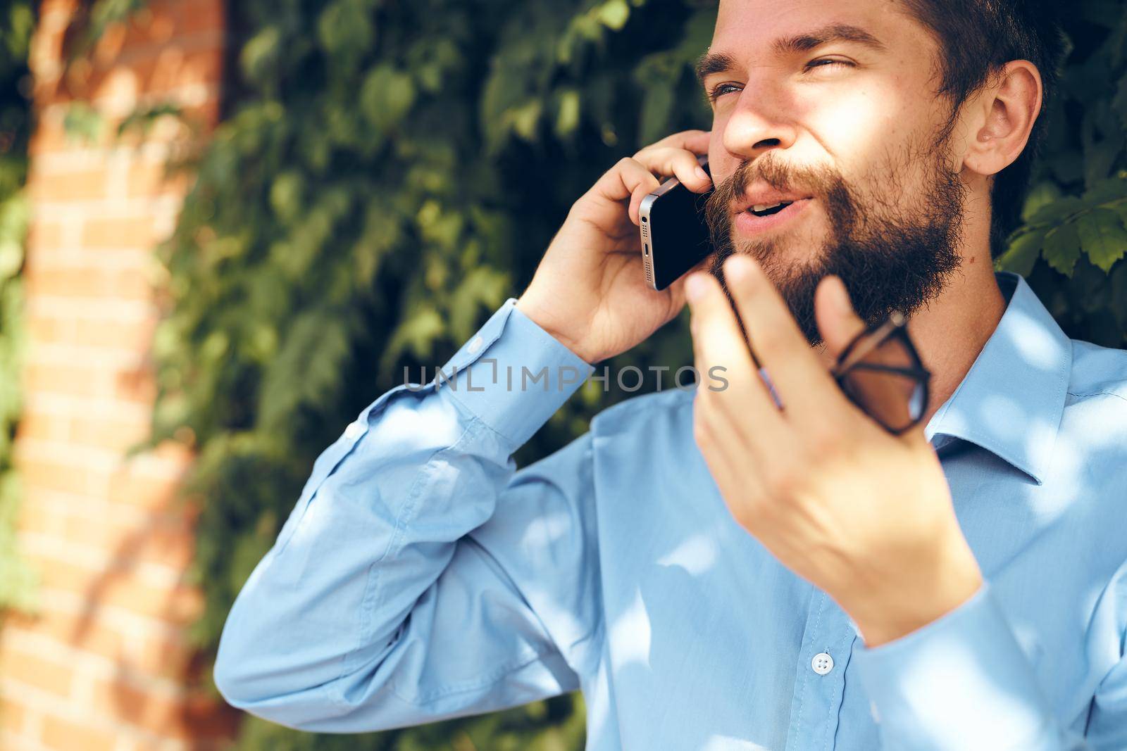 business man with phone outdoors communication lifestyle. High quality photo