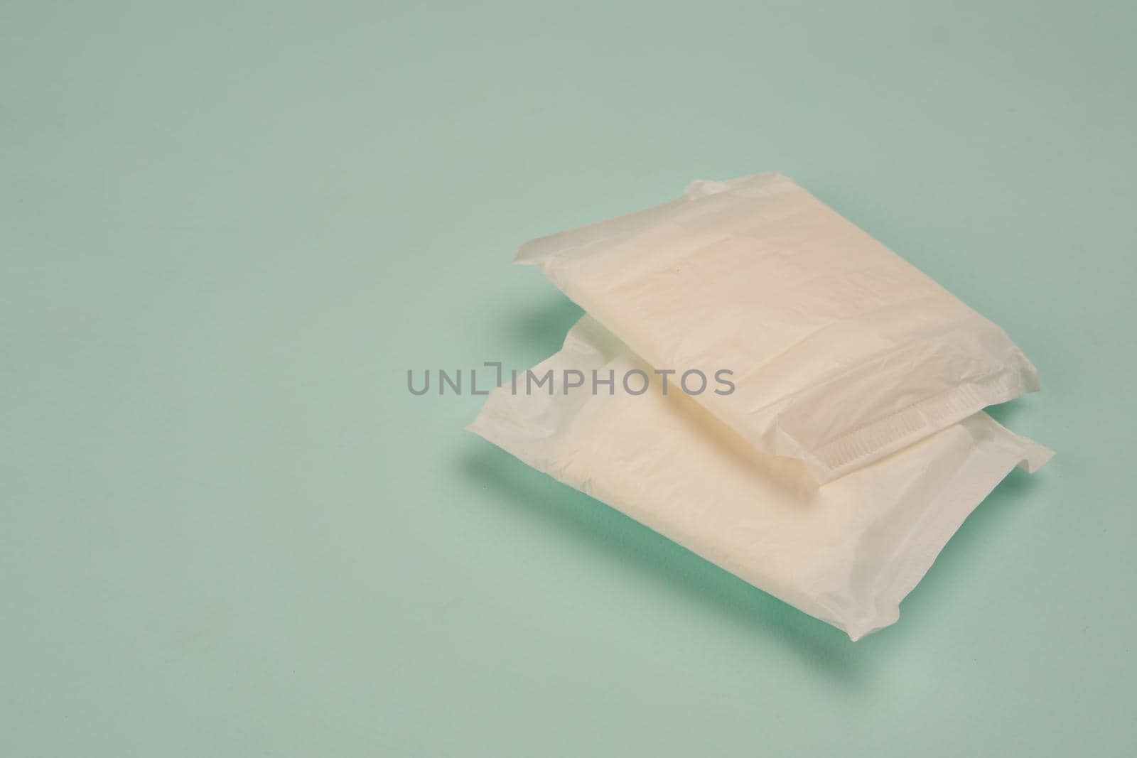 feminine pads underwear hygiene protection medicine blue background by Vichizh