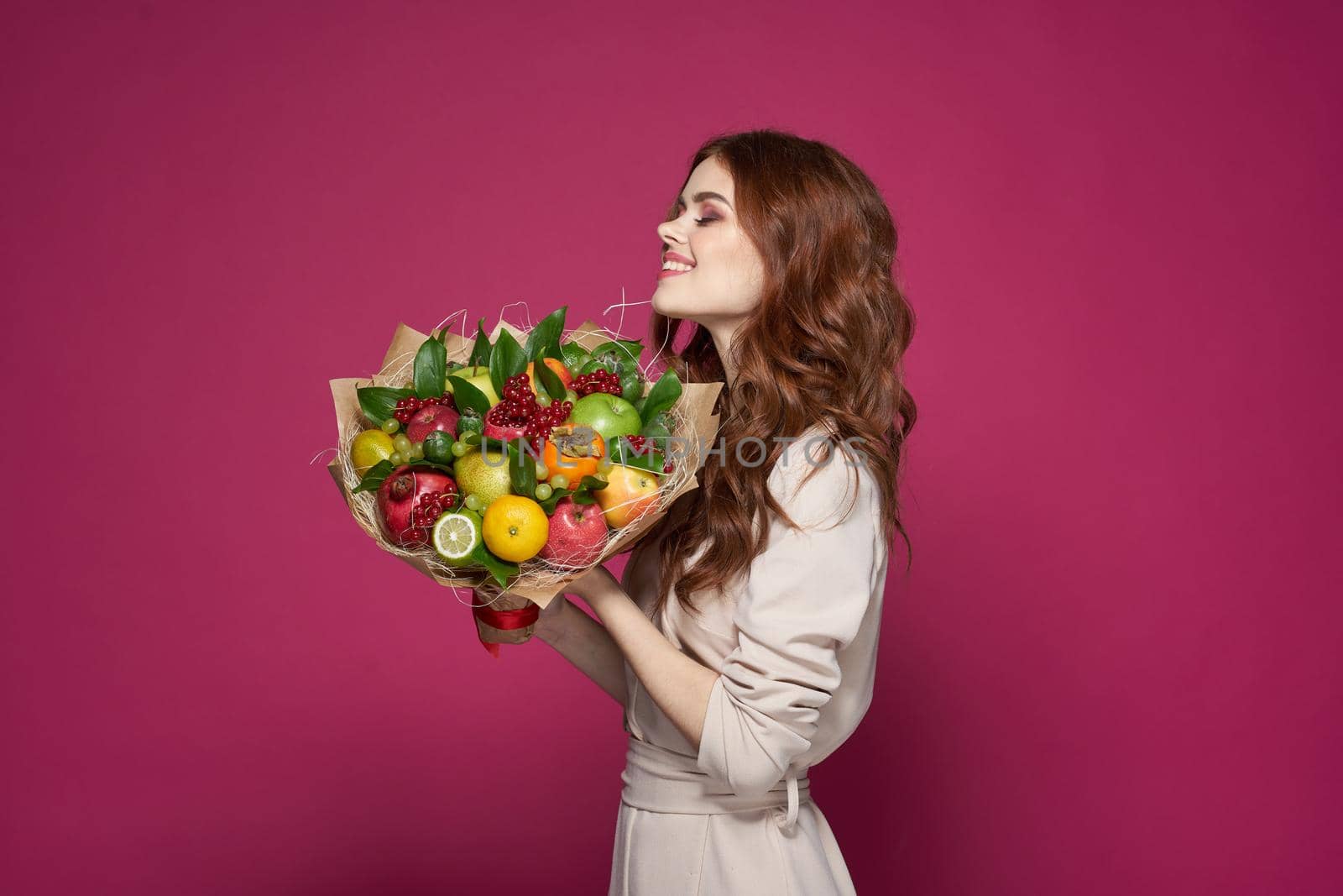 pretty woman smile posing fresh fruits bouquet emotions isolated background. High quality photo