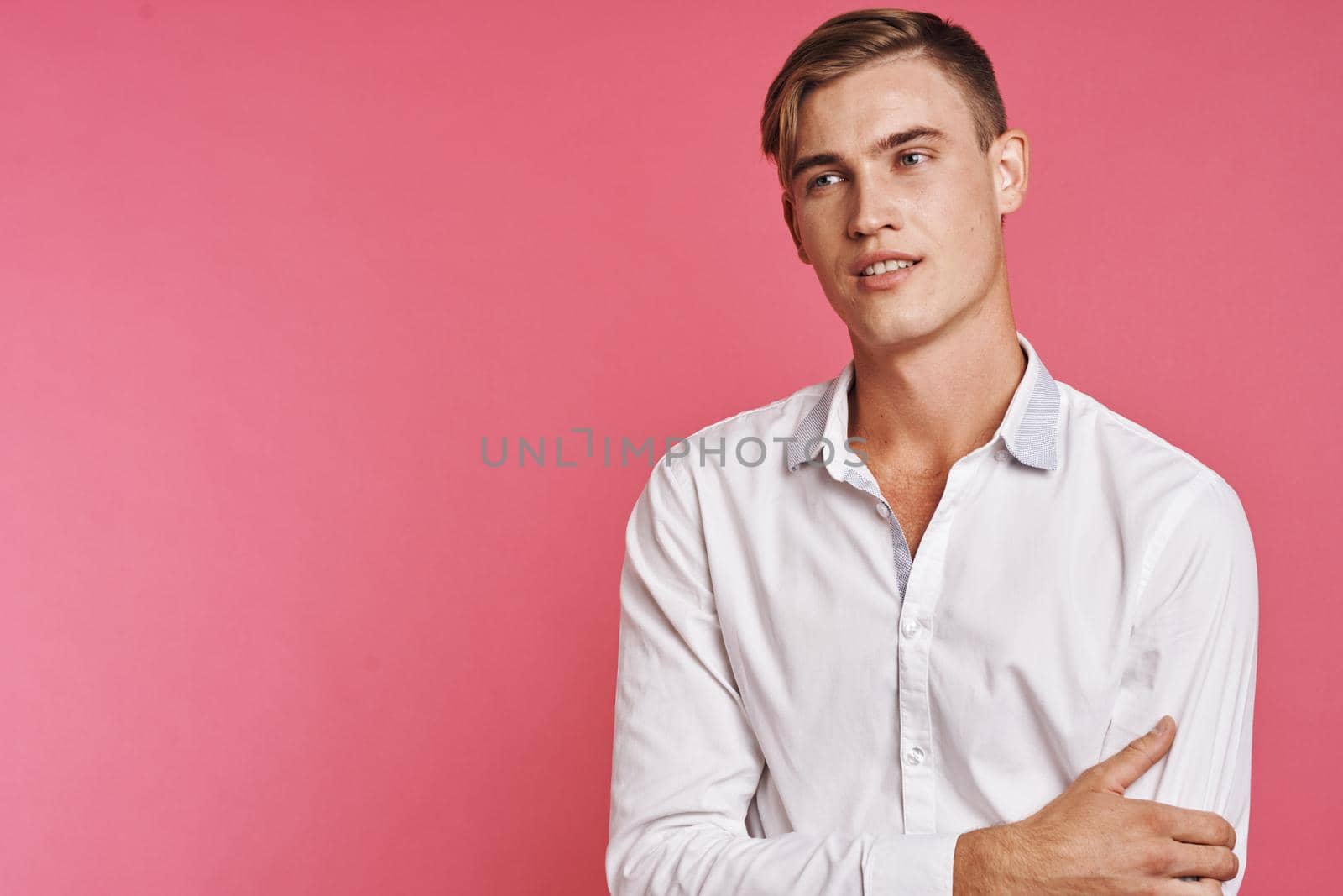 handsome man fashion hairstyle hand gestures modern style isolated background. High quality photo