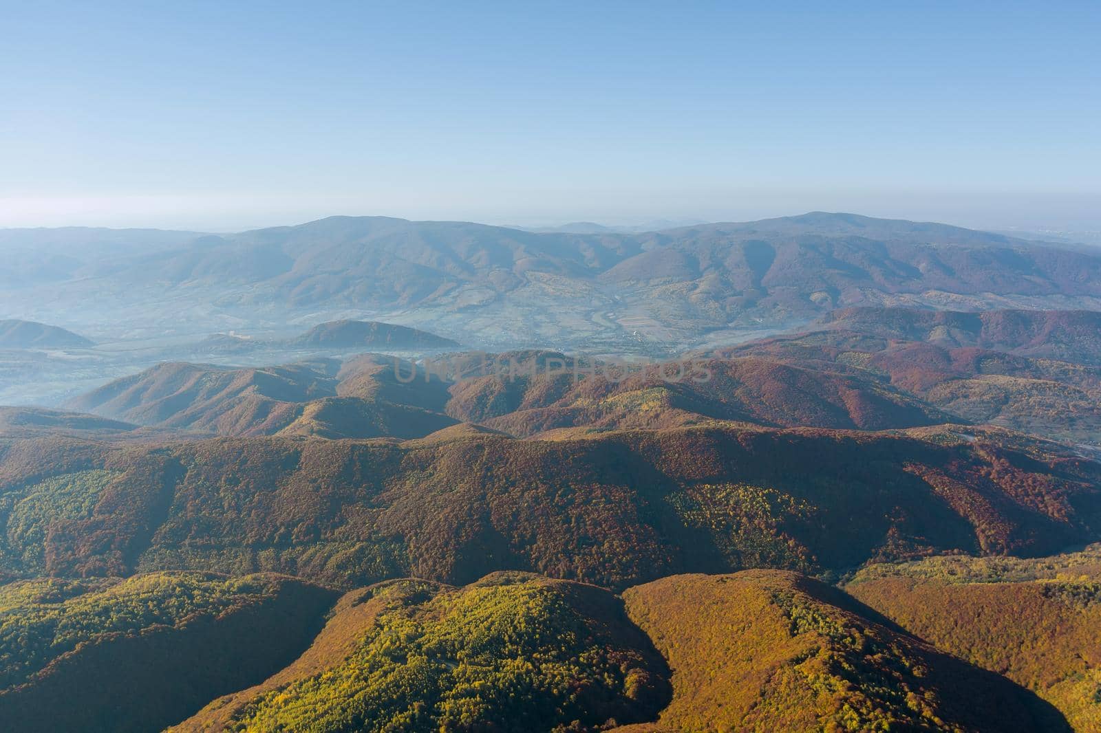 Panoramic top view in picturesque autumn meadows forest mountain peaks rural countryside