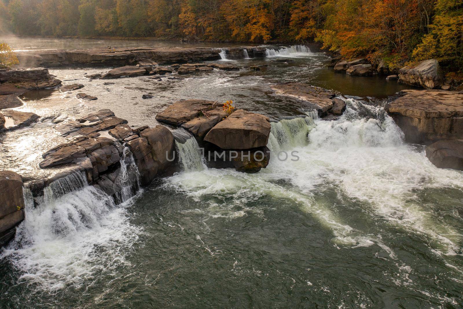 Valley Falls State Park near Fairmont in West Virginia on a colorful misty autumn day with fall colors on the trees