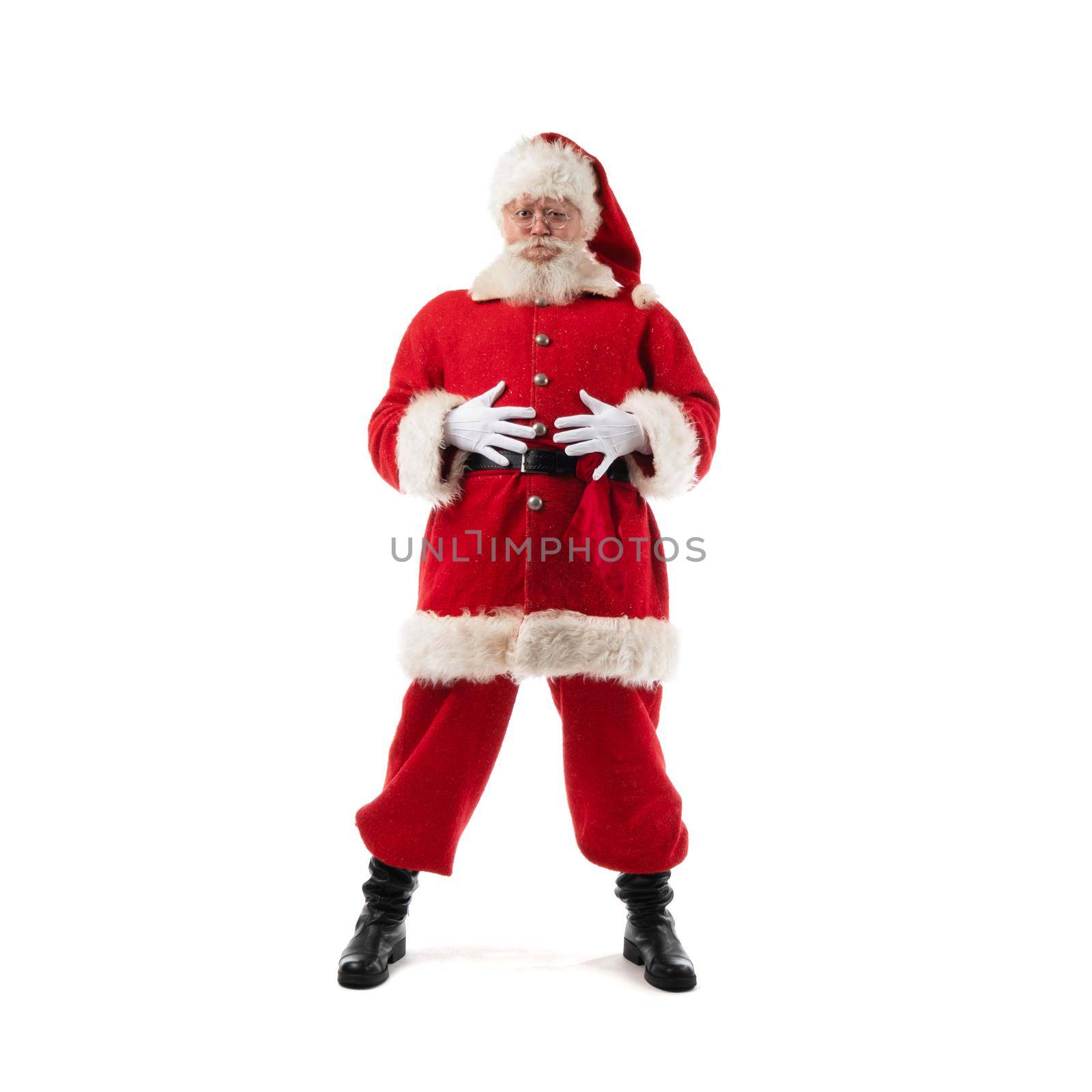 Santa Claus with hands on belly holding his hands on belt, isolated on white background.