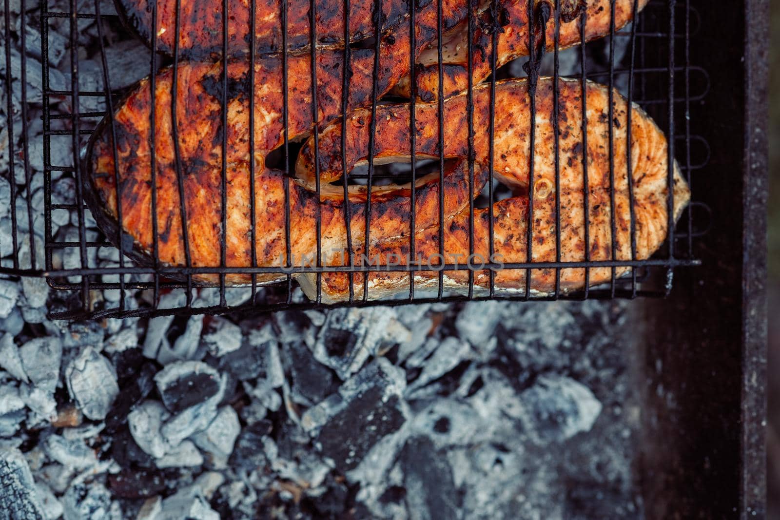 cooking fish outdoors barbecue close-up charcoal meal. High quality photo