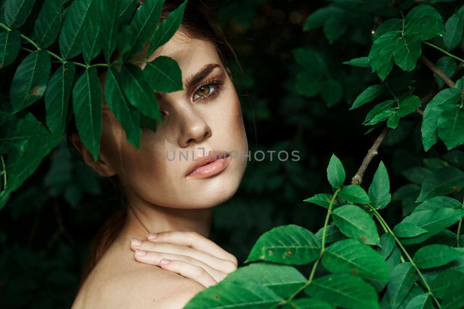 portrait of a woman green leaves clean skin nature summer close-up by Vichizh