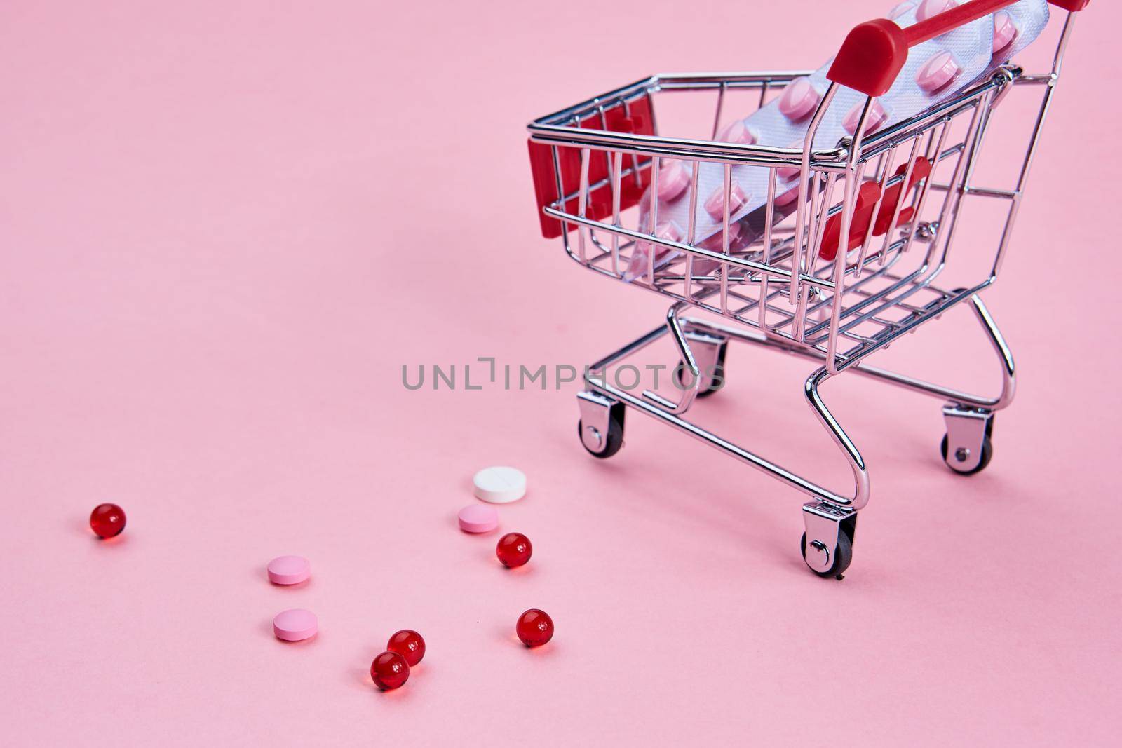 small cart with a pack of drugs pharmacy shopping service medicine. High quality photo