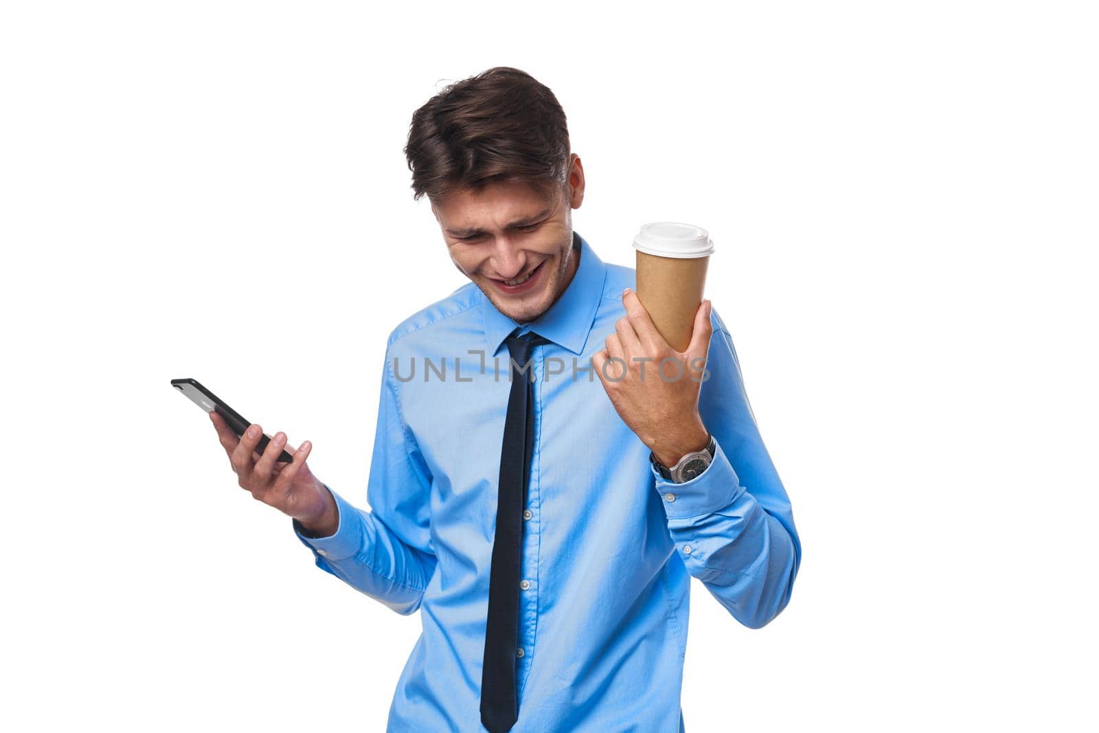 man in shirt with tie communication on the phone a cup of coffee studio lifestyle. High quality photo