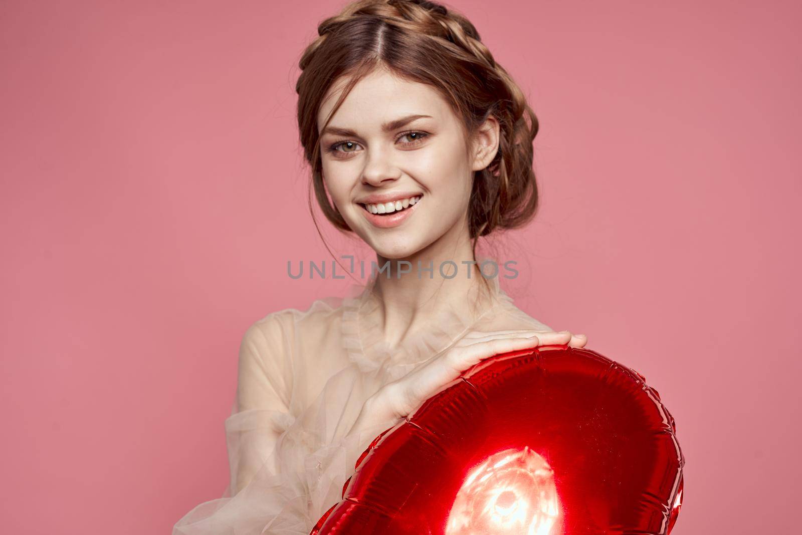 beautiful woman in a dress balloon Valentine's Day model studio. High quality photo