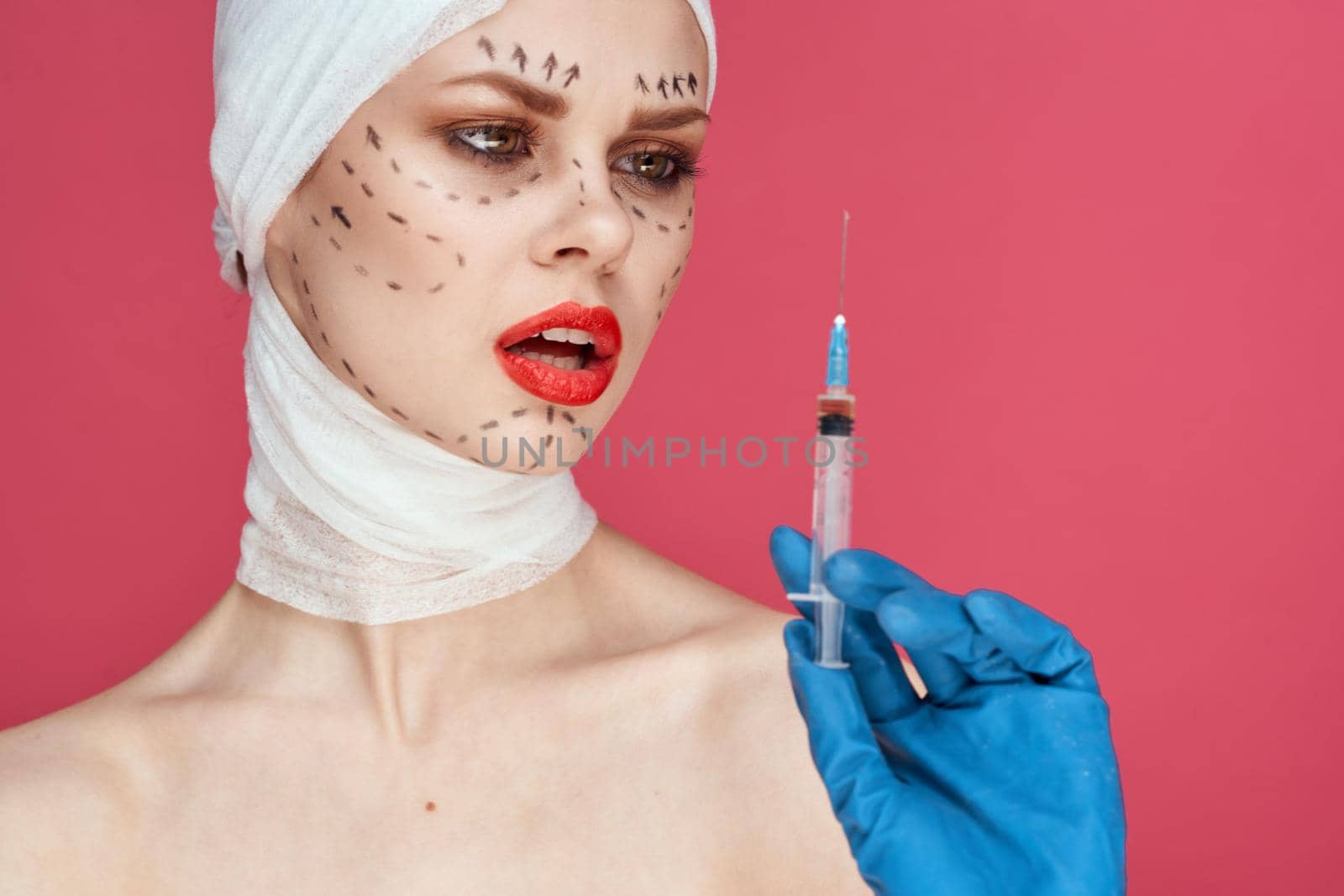 female patient in blue gloves syringe in hands contour on the face lifting studio lifestyle by Vichizh