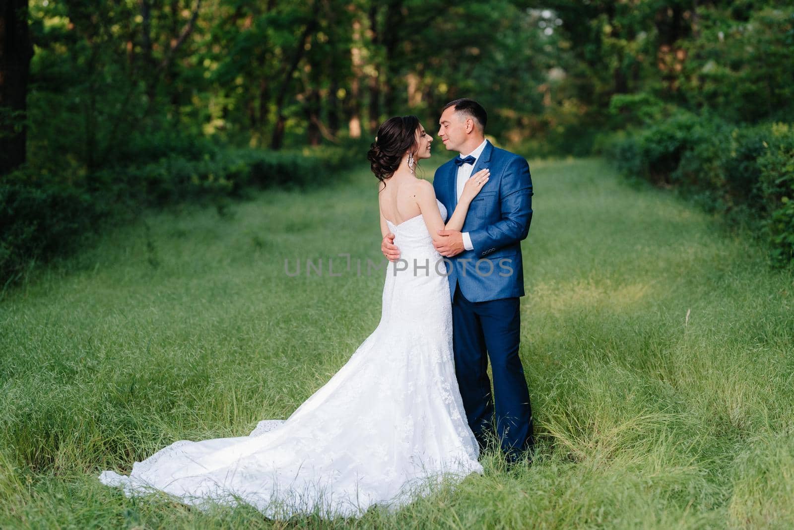 A couple in love a guy and a girl on a walk in the forest belt