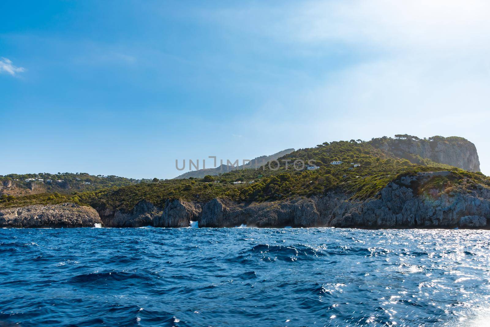 Silhouette of Capri island on Tyrrhenian Sea in Italy seen from boat by Wierzchu