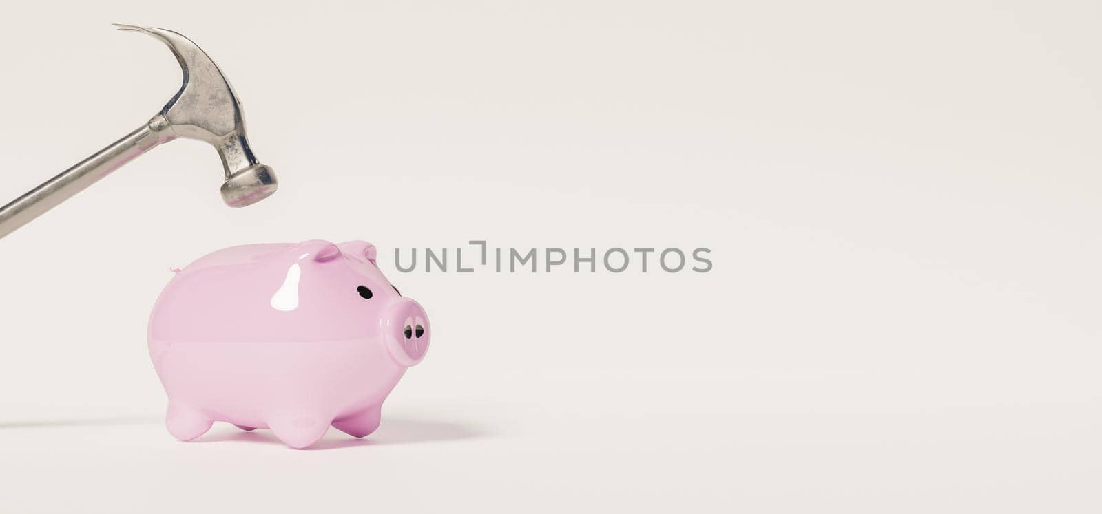 banner of small pink piggy bank with a hammer on top that is going to break it on white background. concept savings. 3d rendering