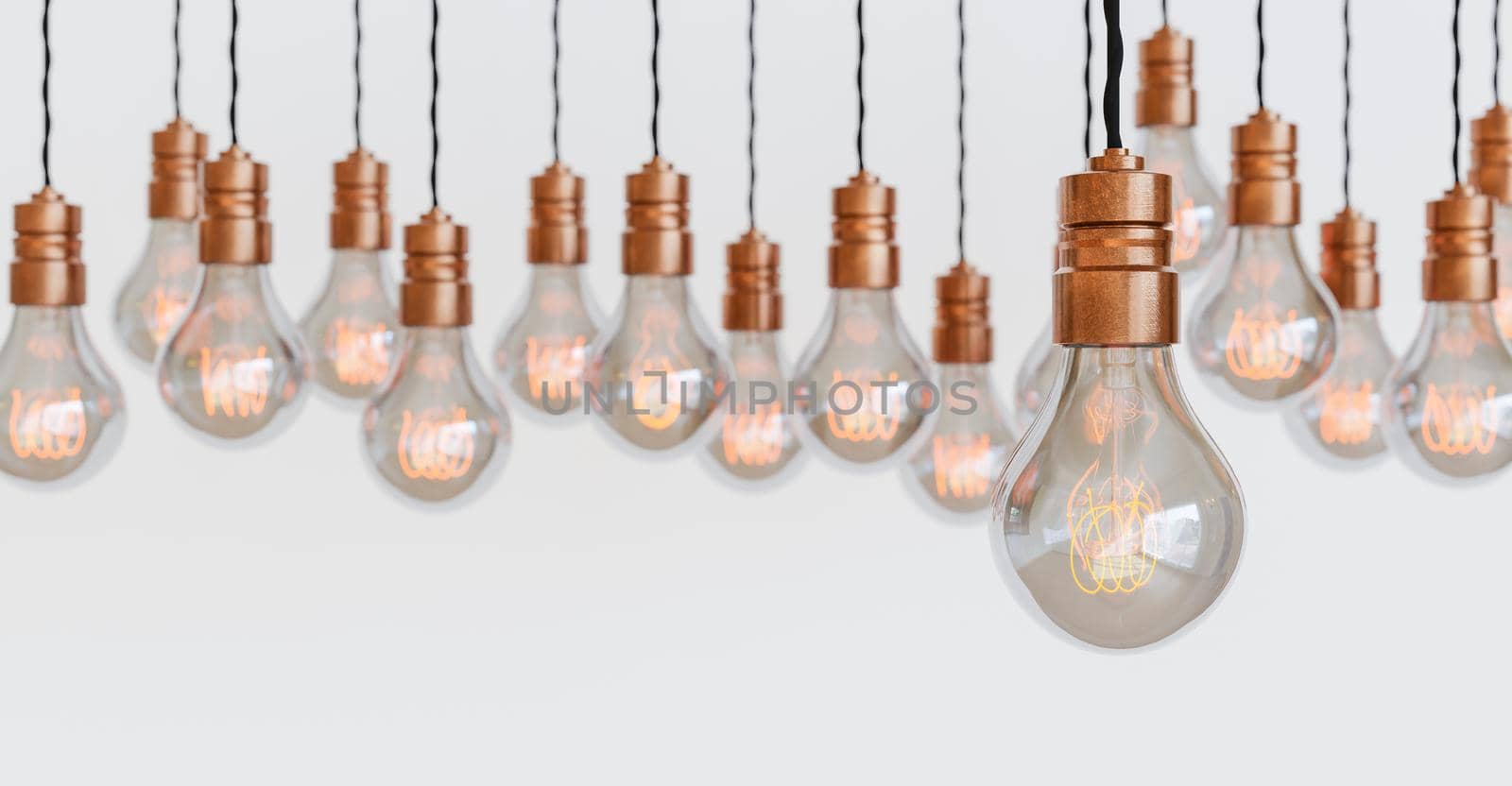 light bulbs hanging with orange filament by asolano