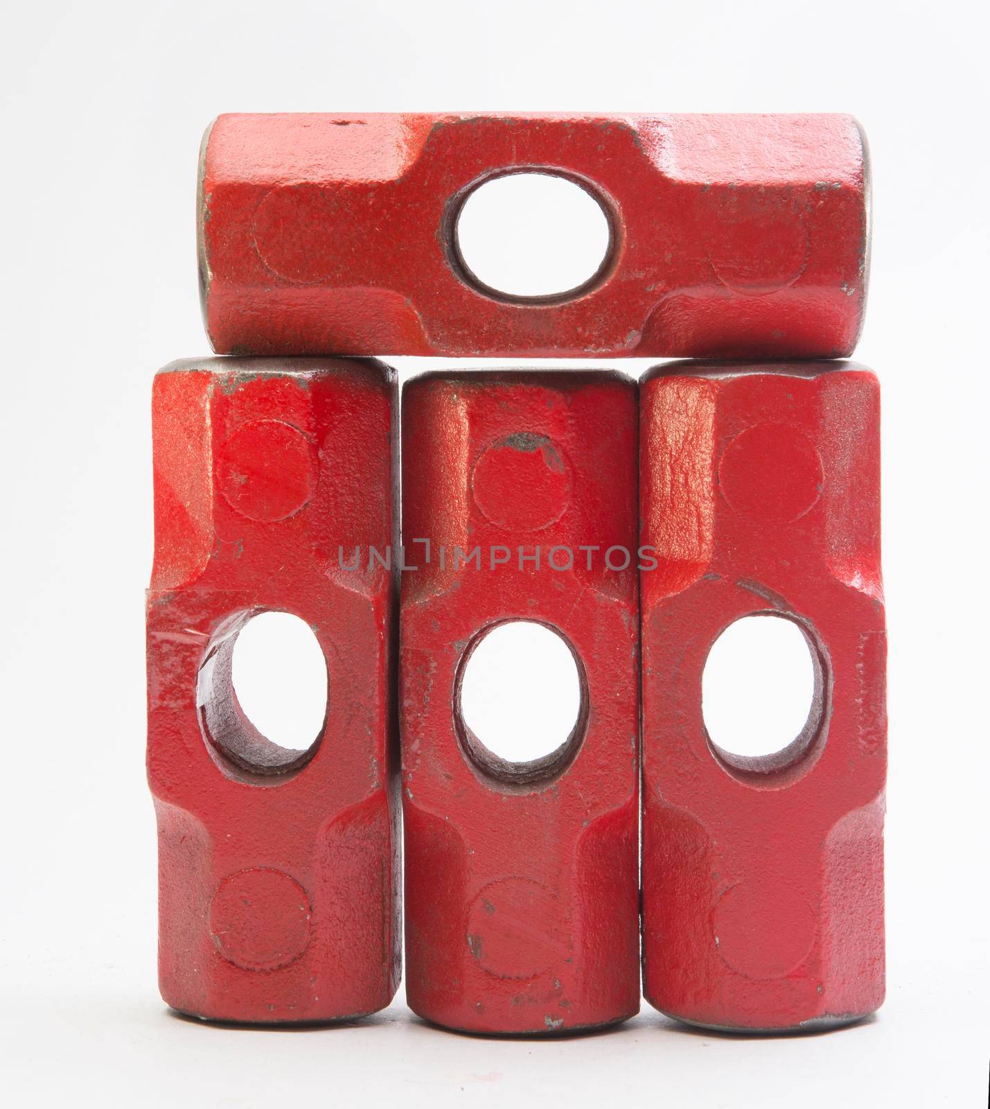 Red metal sledge hammer on a white background