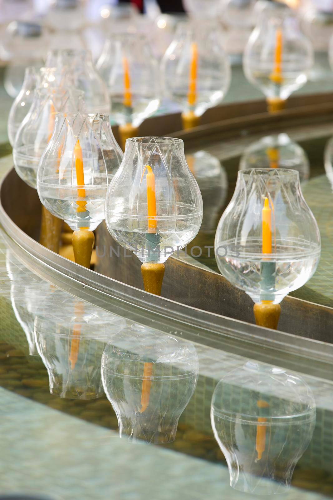 Glass candle holder for candles in Buddhism