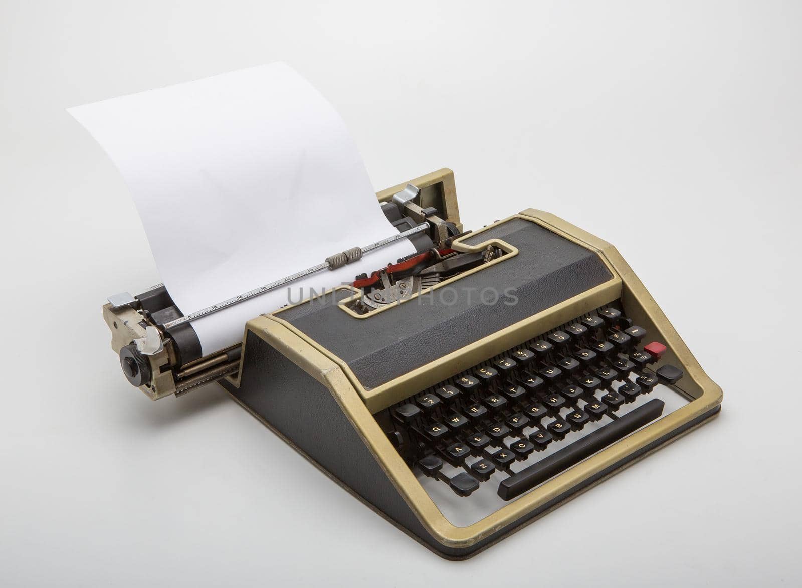 Old typewriter on white background