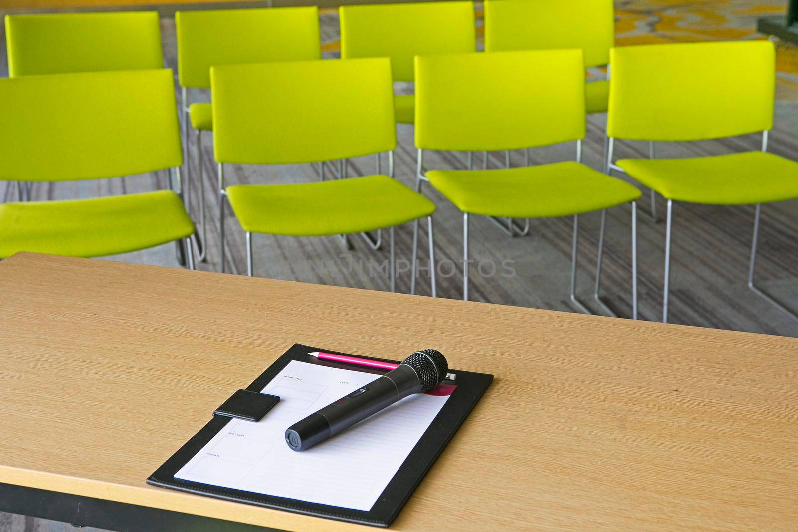 Paper and pen on the table in the meeting room.