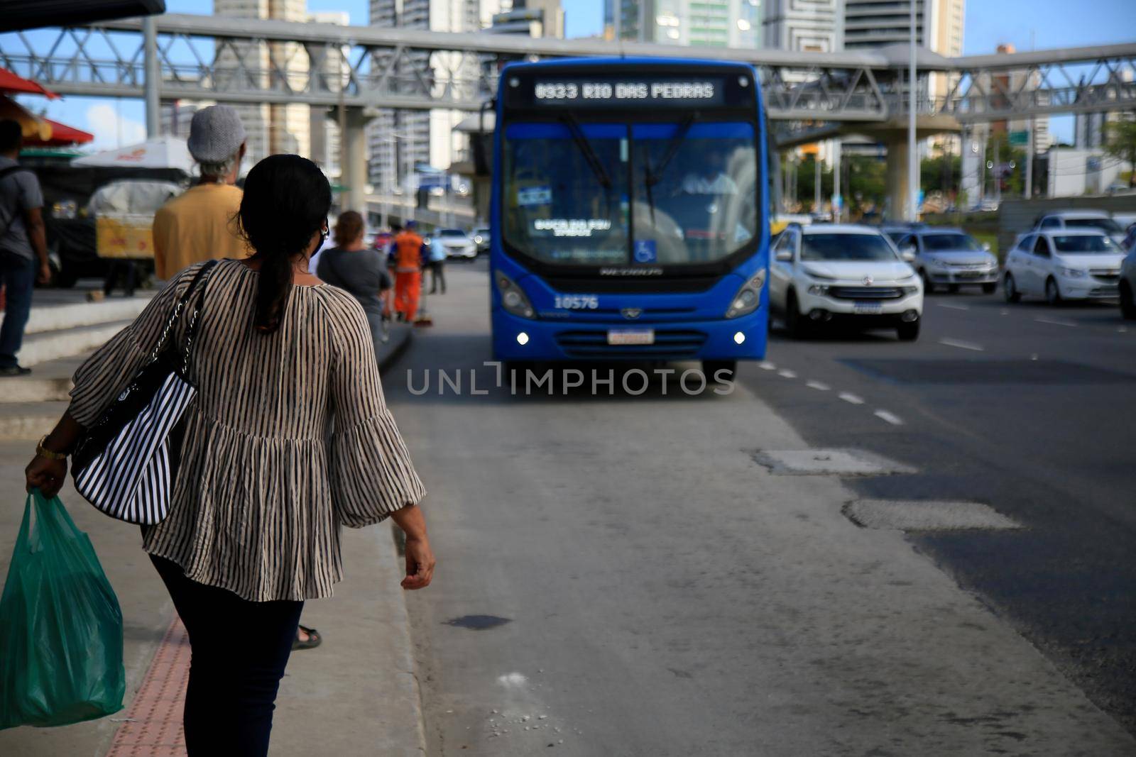  passengers are seen waiting for public transport buses by joasouza