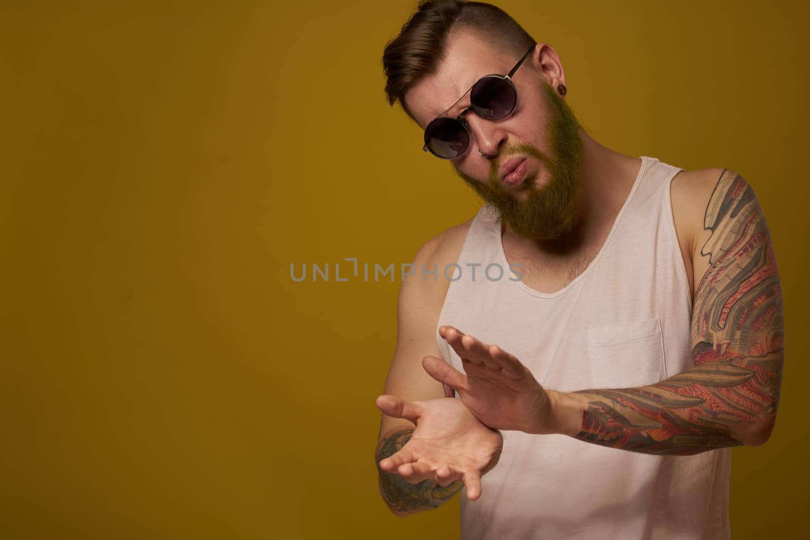 man in a white t-shirt tattoos on his arms fashion glasses modern style by Vichizh