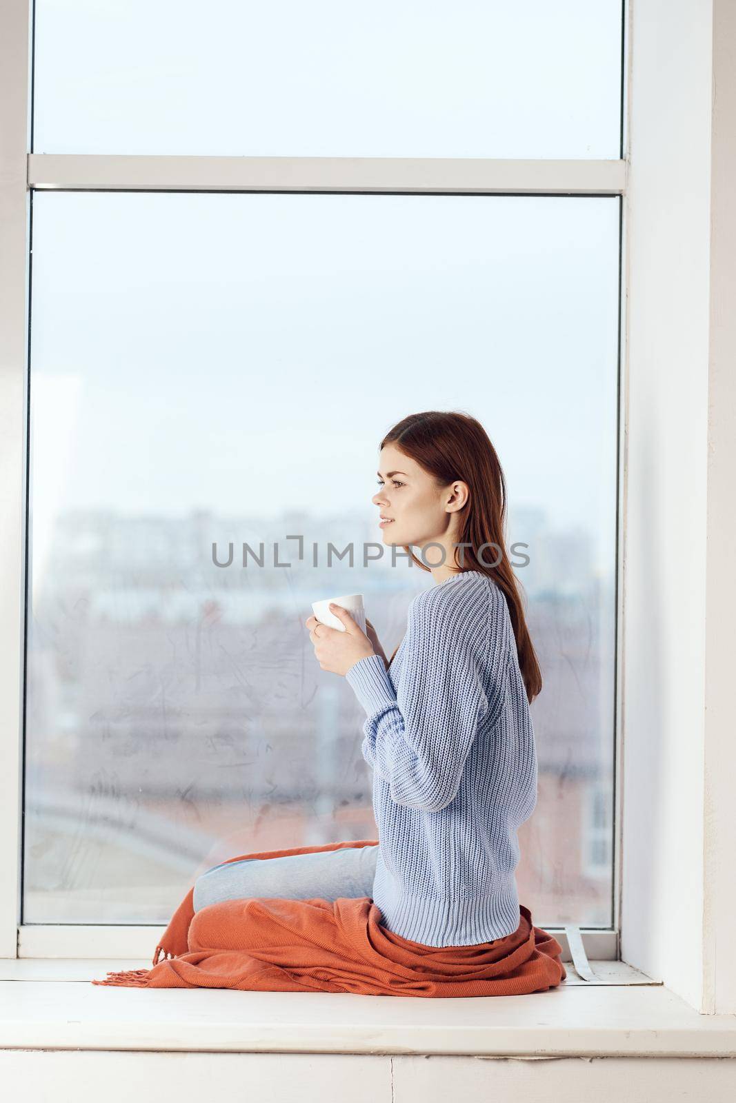 woman near the window dreamy look rest at home comfort by Vichizh