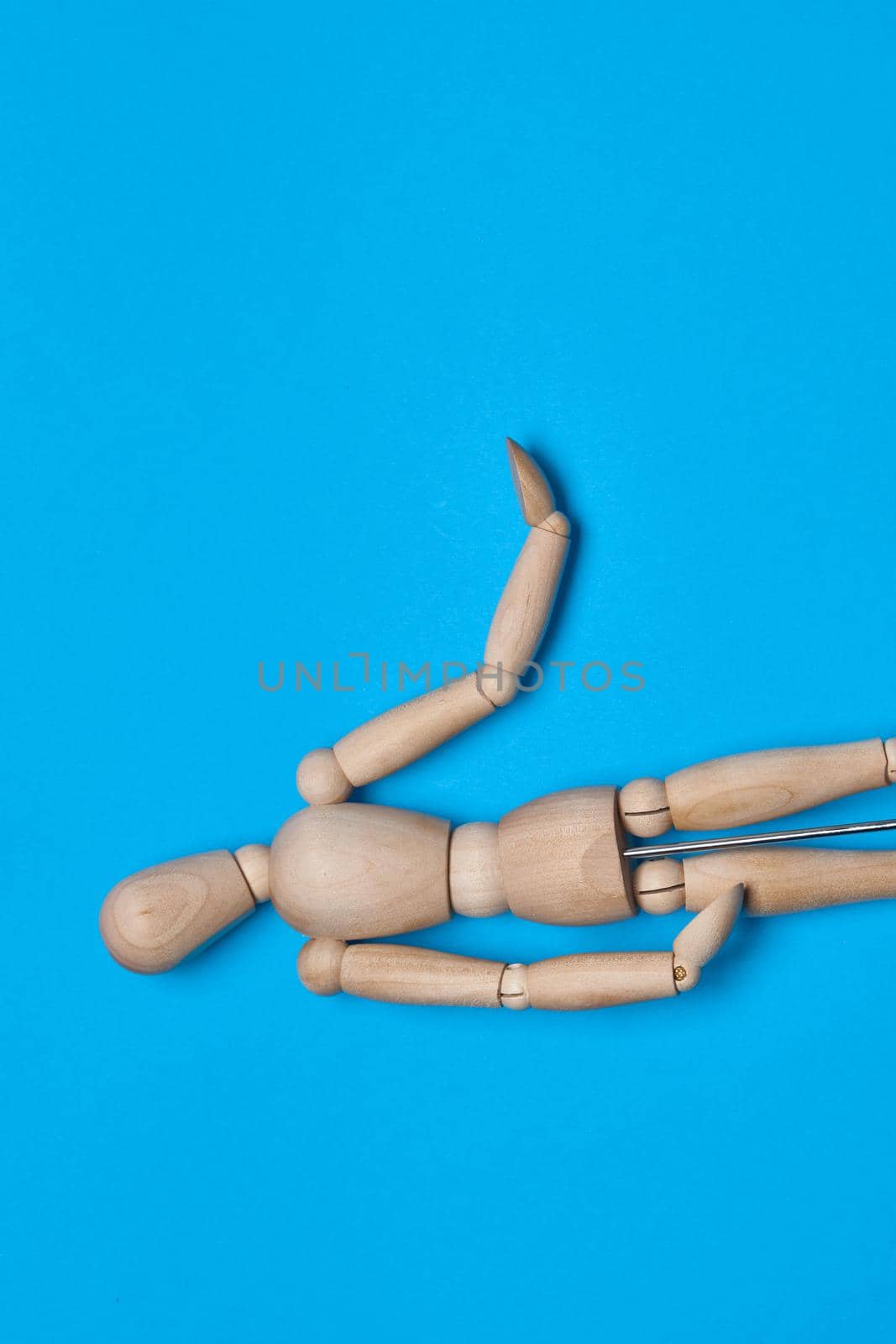 wooden figure mannequin object posing blue background by Vichizh