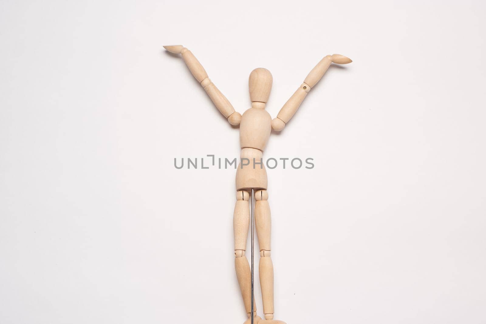 wooden mannequin object light background posing. High quality photo