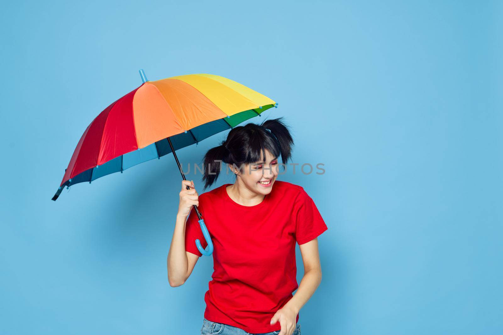 cheerful woman in red t-shirt rainbow color umbrella fashion by Vichizh