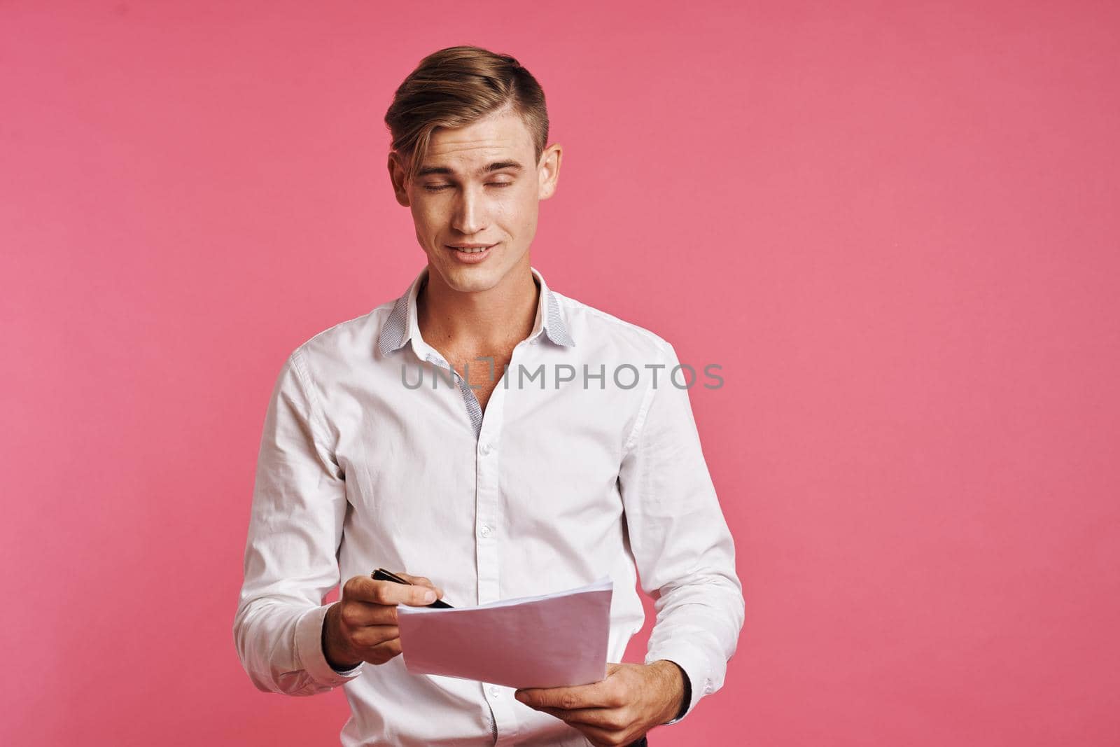 portrait of a man reading documents in hand isolated background. High quality photo