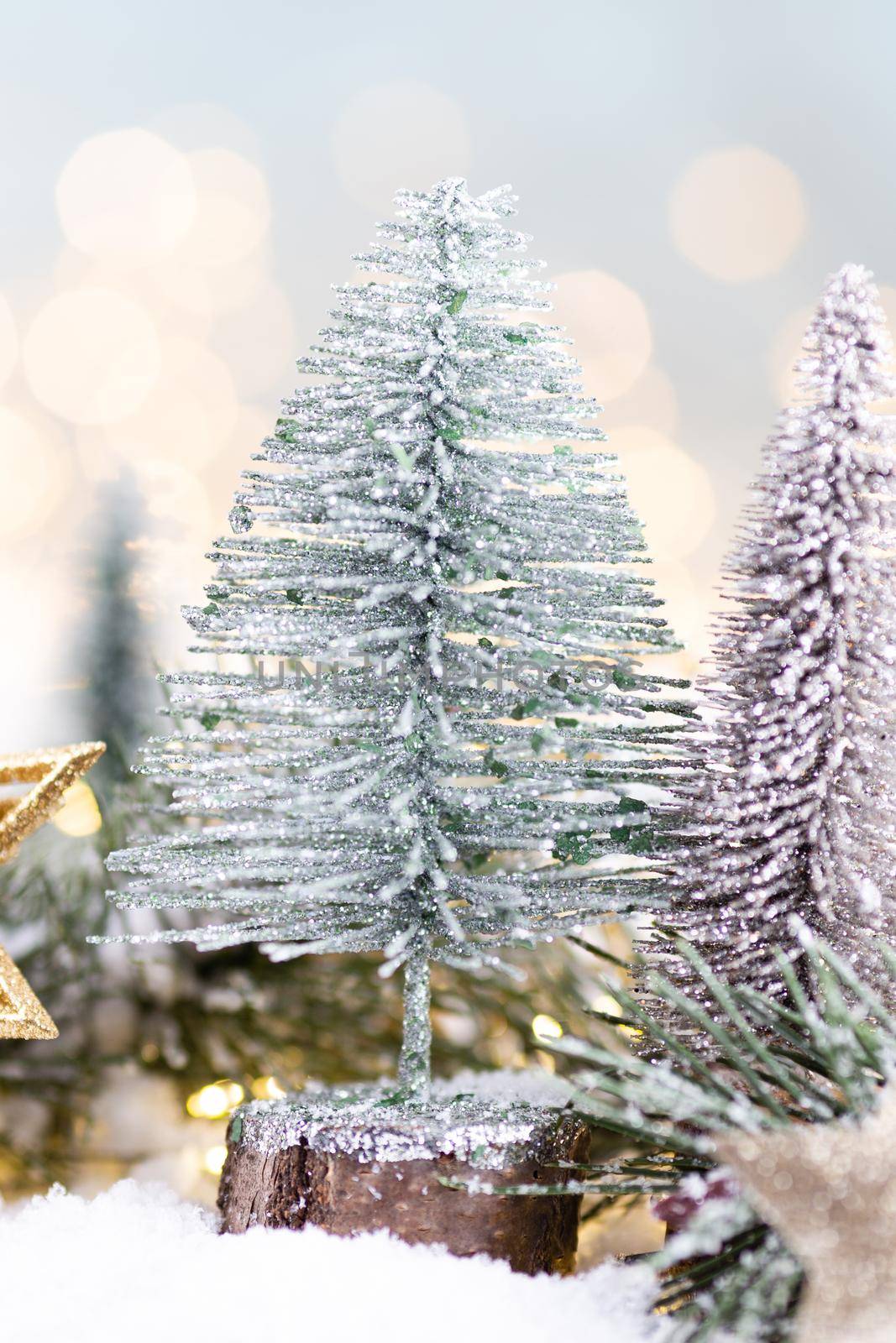 Christmas background with tree and blurred shiny lights.