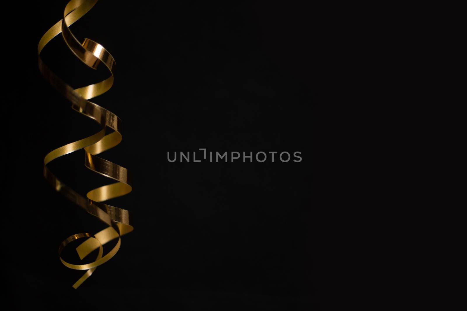 Black Friday sale background with curly golden ribbon luxury special offer design concept, copy space for text content
