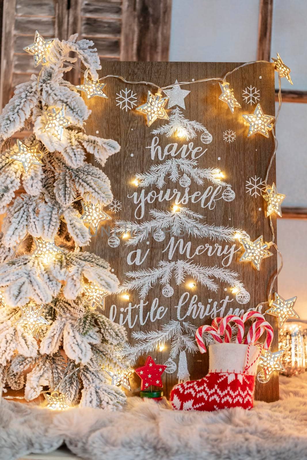 Board with Merry Christmas message on wooden background.