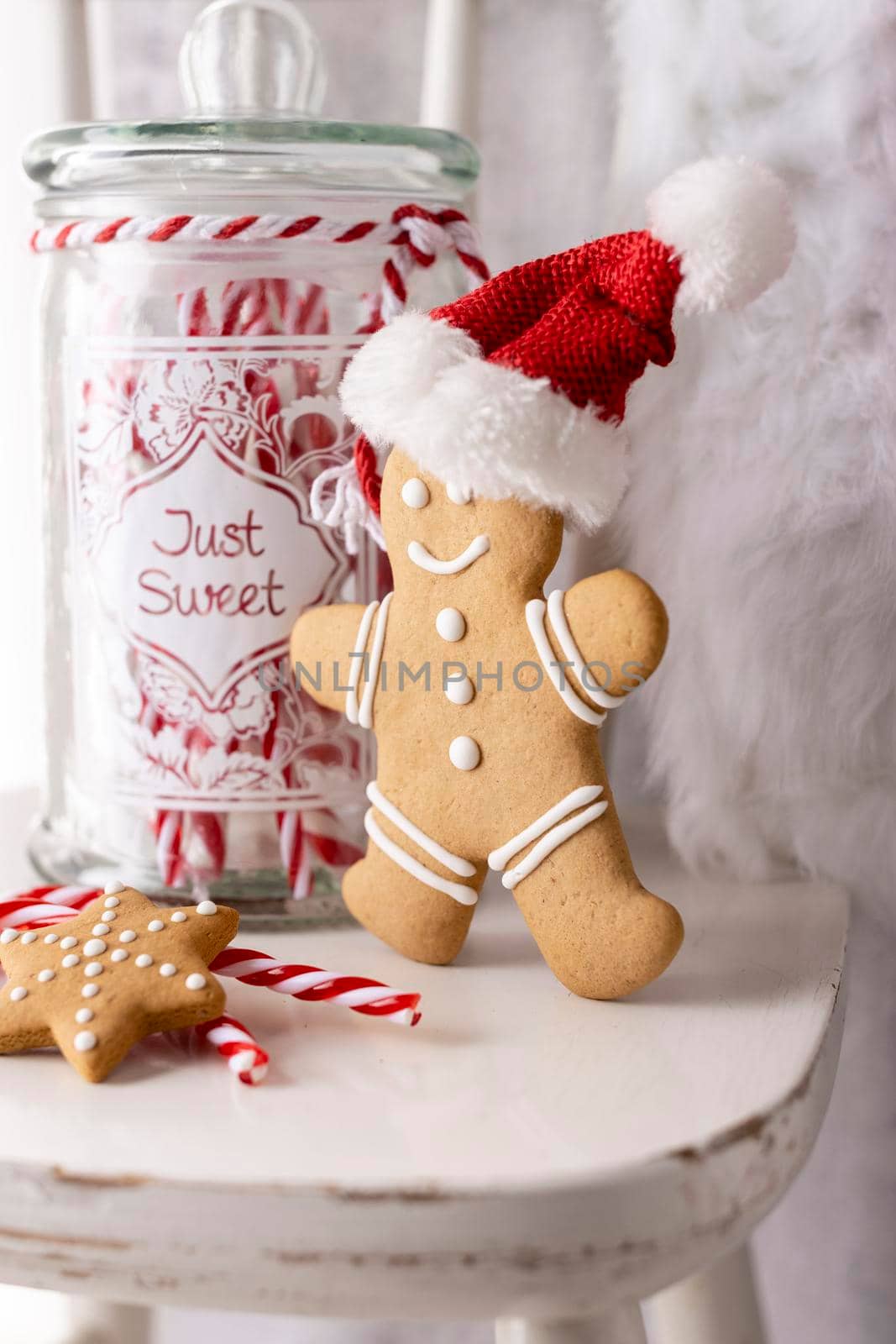 Christmas Santa Claus Hat Hanging On Wood chair, Xmas Concept, Decoration Over Grunge Wooden Background.
