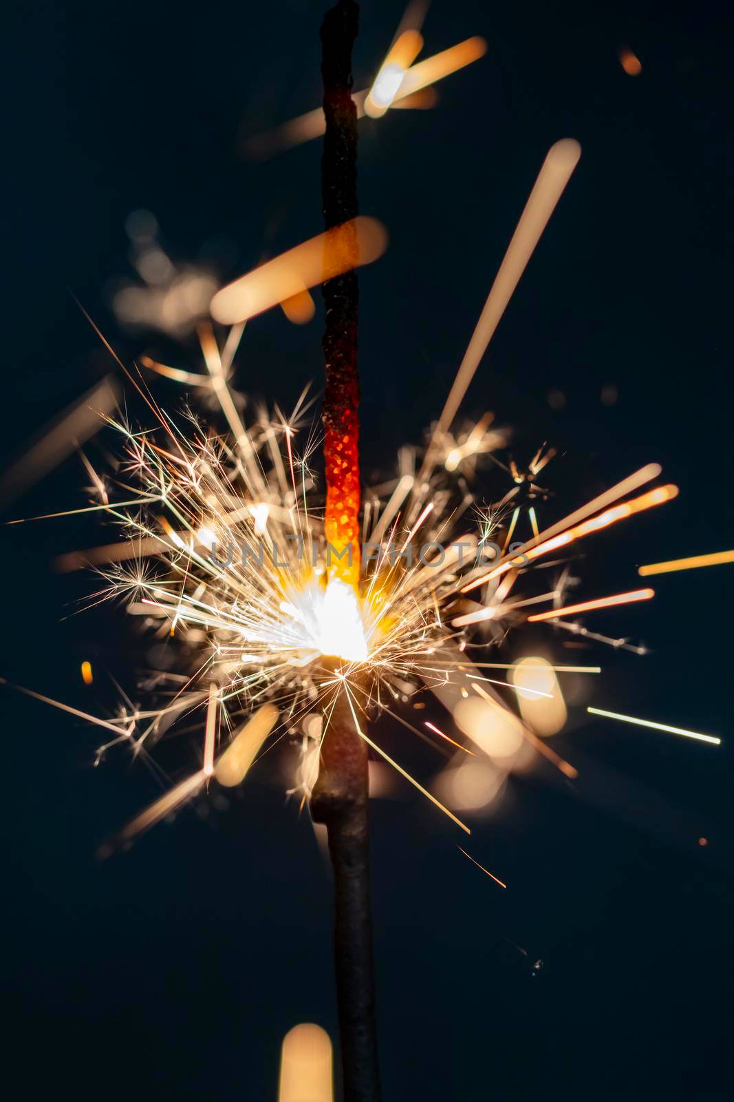 Christmas sparkler lights on black background.