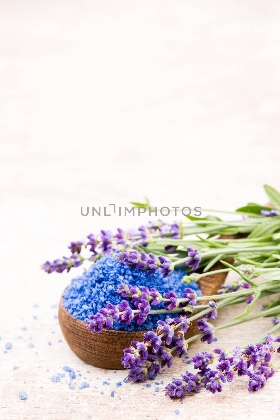Essential lavender salt with flowers top view. by gitusik