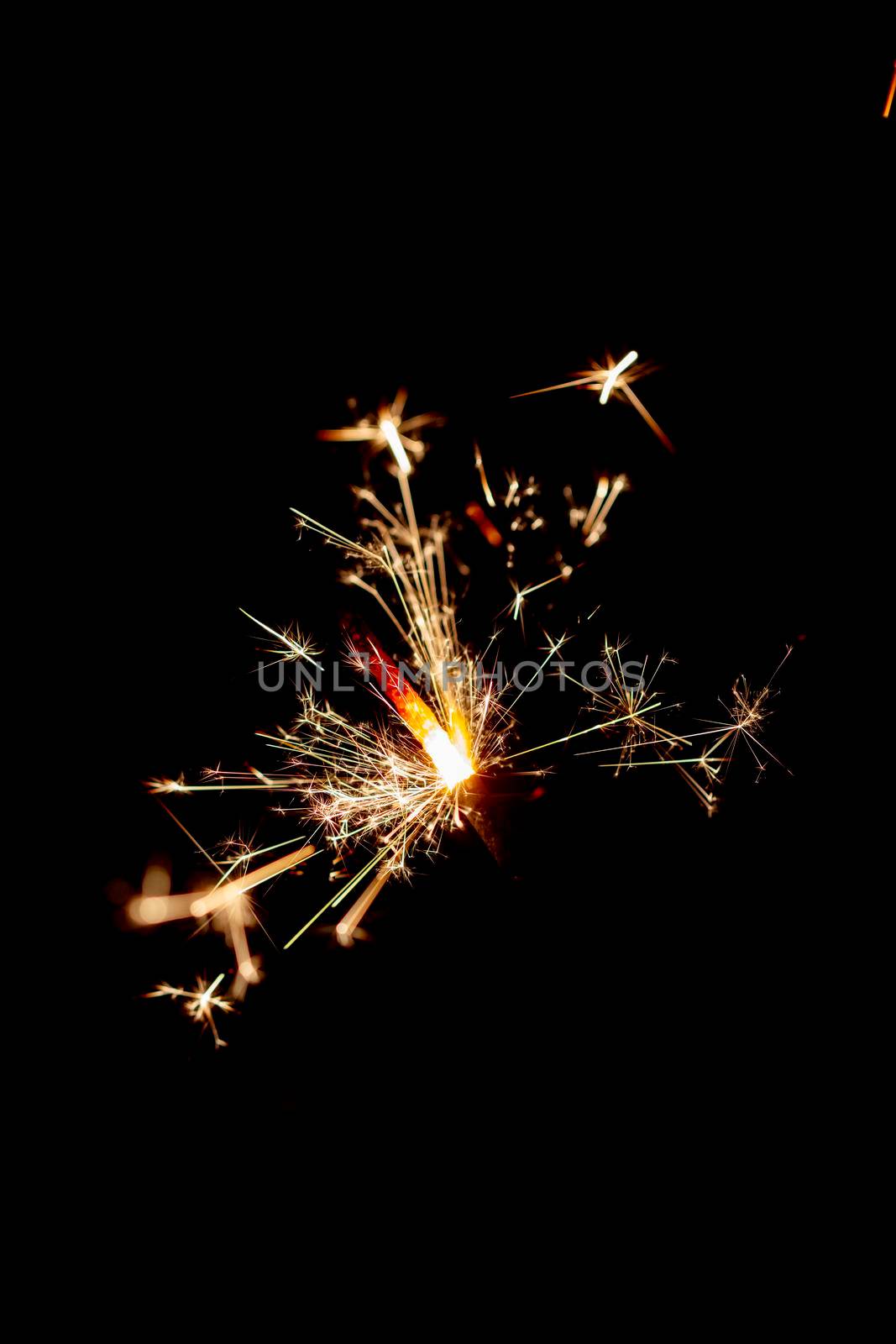 One bengal fire sparkles against the black background. by gitusik